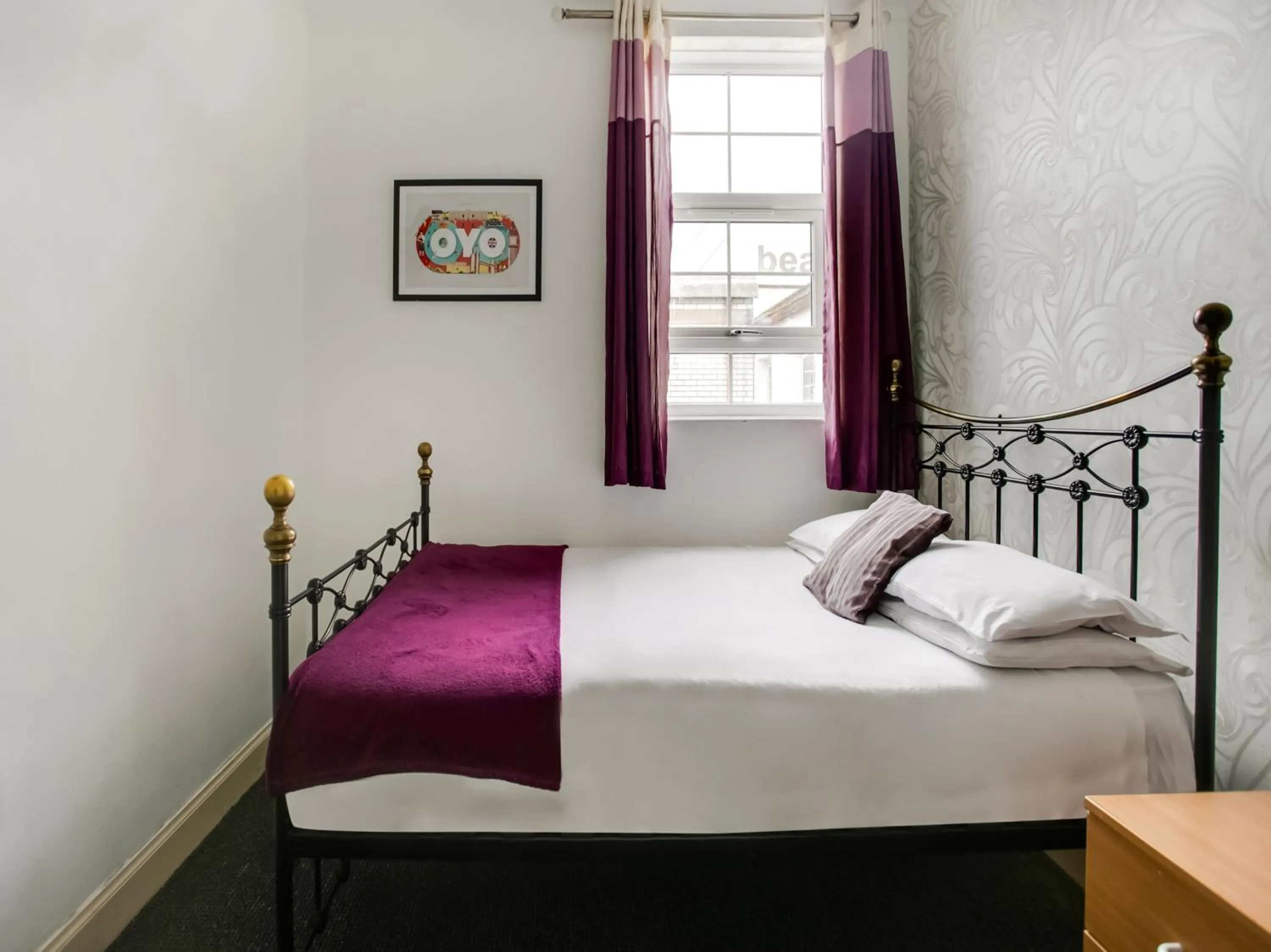 Photo of the whole room, Bed in OYO Gin House Hotel