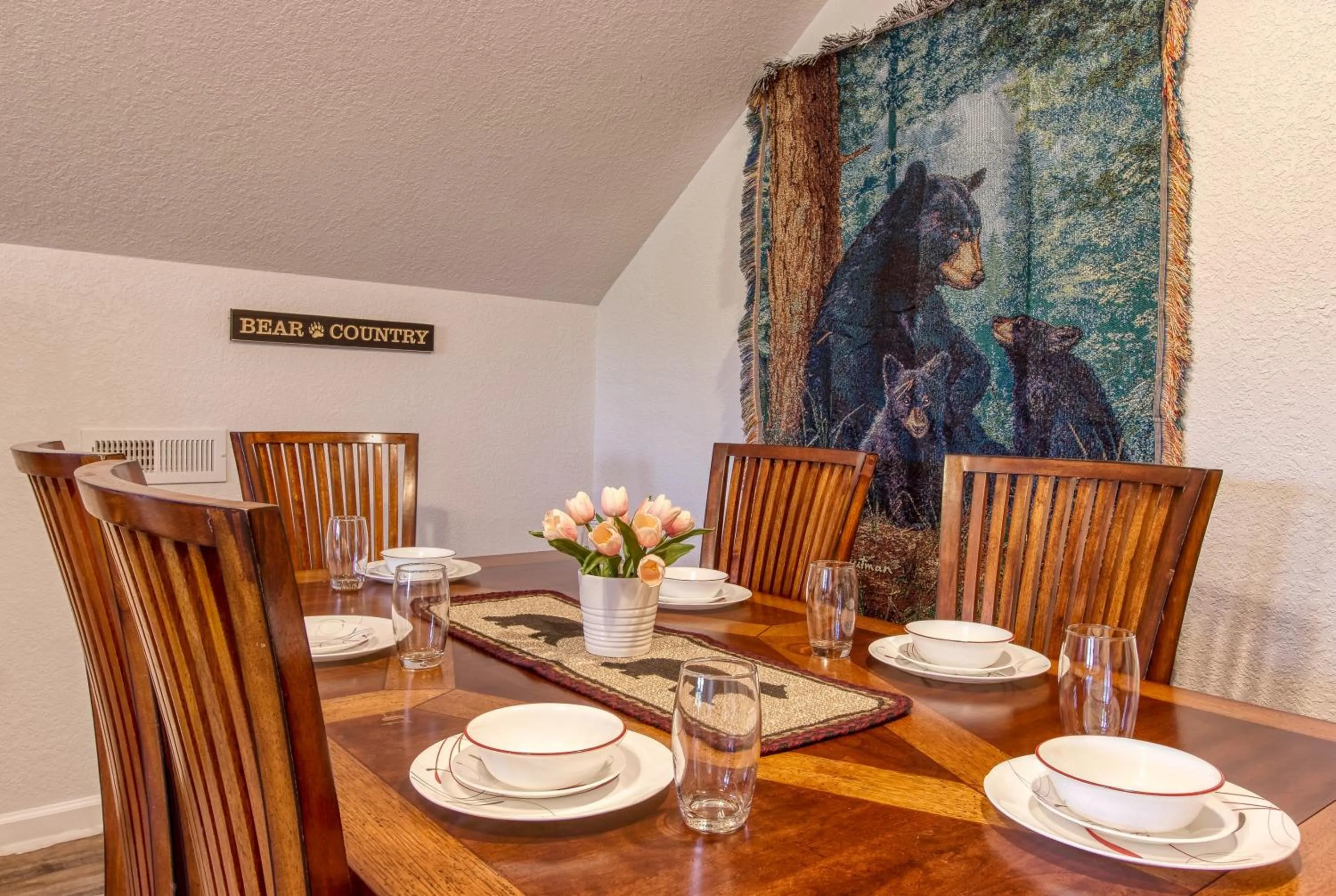 Dining area in Rustic River Lodge by HoneyBearCabins 7BR 6BA sleeps 21
