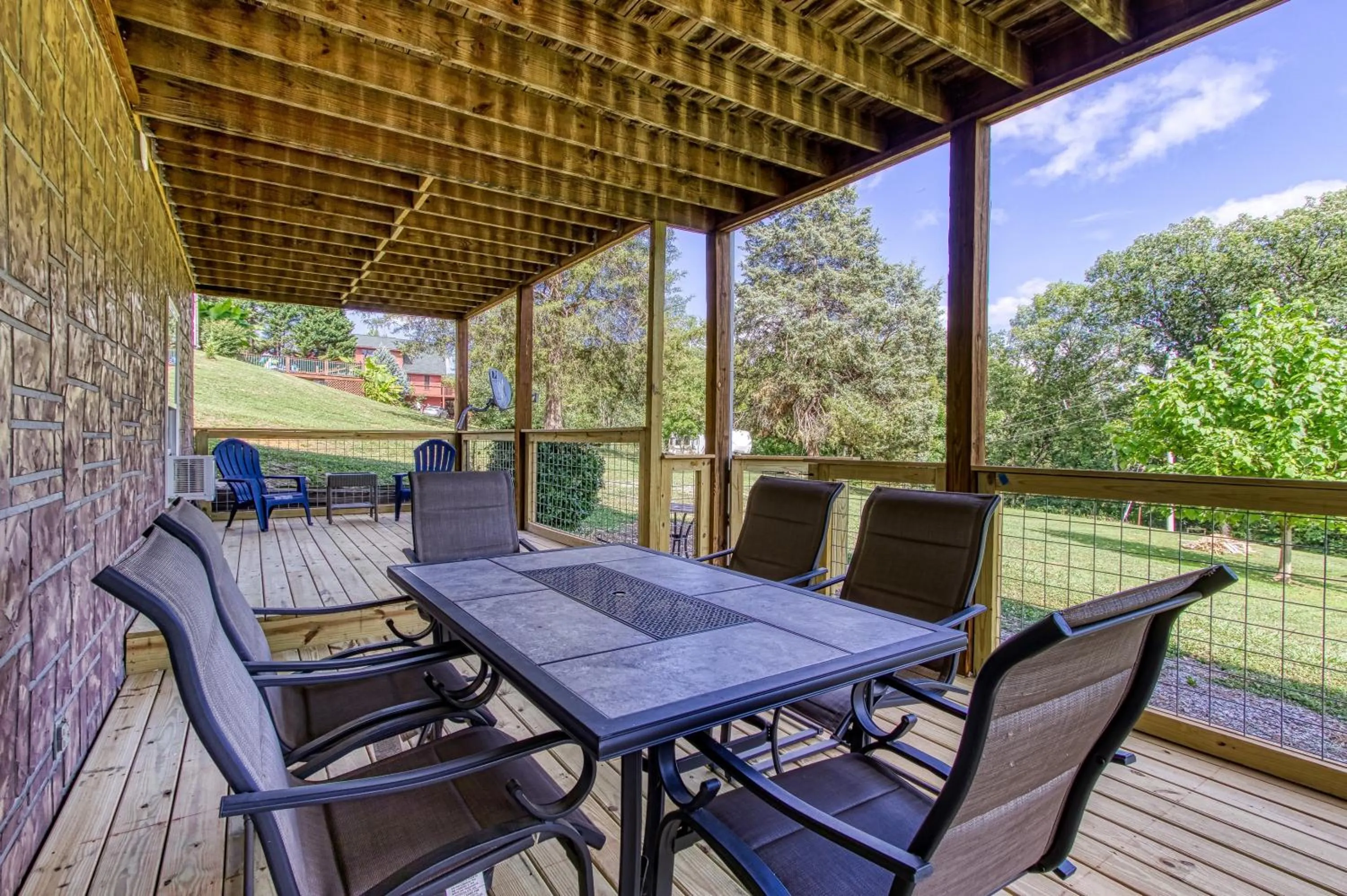 Patio in Rustic River Lodge by HoneyBearCabins 7BR 6BA sleeps 21