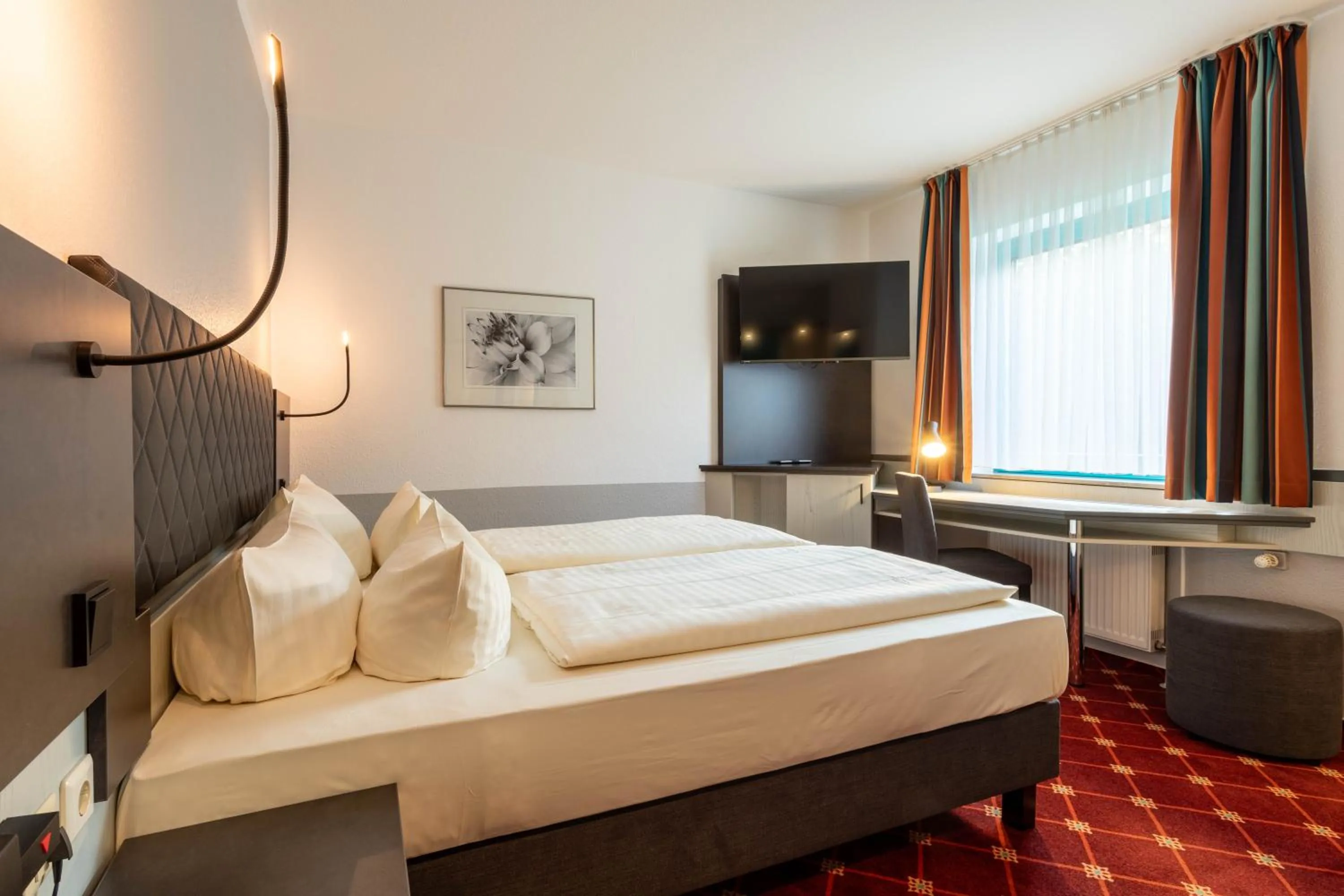 Photo of the whole room, Bed in Montana Trend Hotel Lehrte