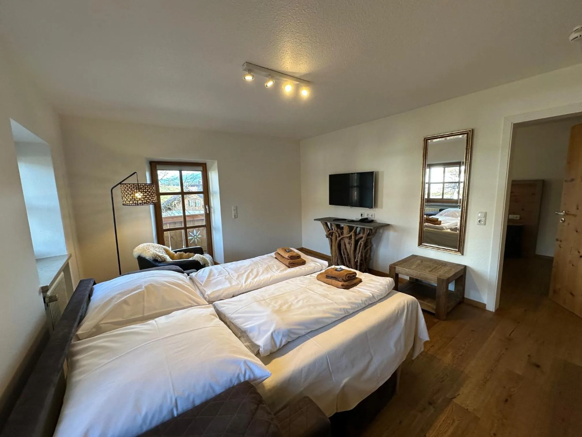 Living room, Bed in Landhaus Kössel
