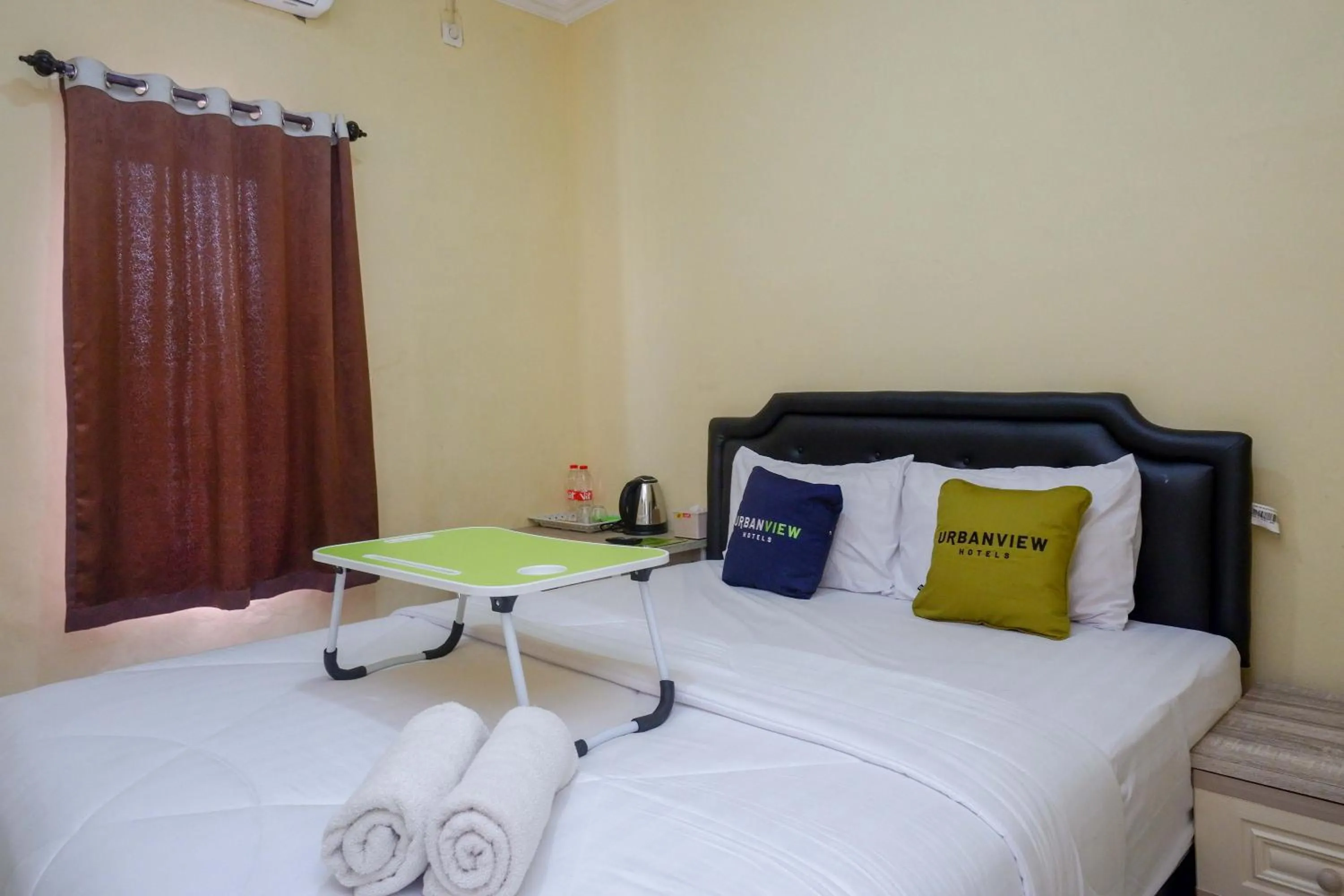 Bedroom, Bed in Urbanview Hotel Jogja City Mall