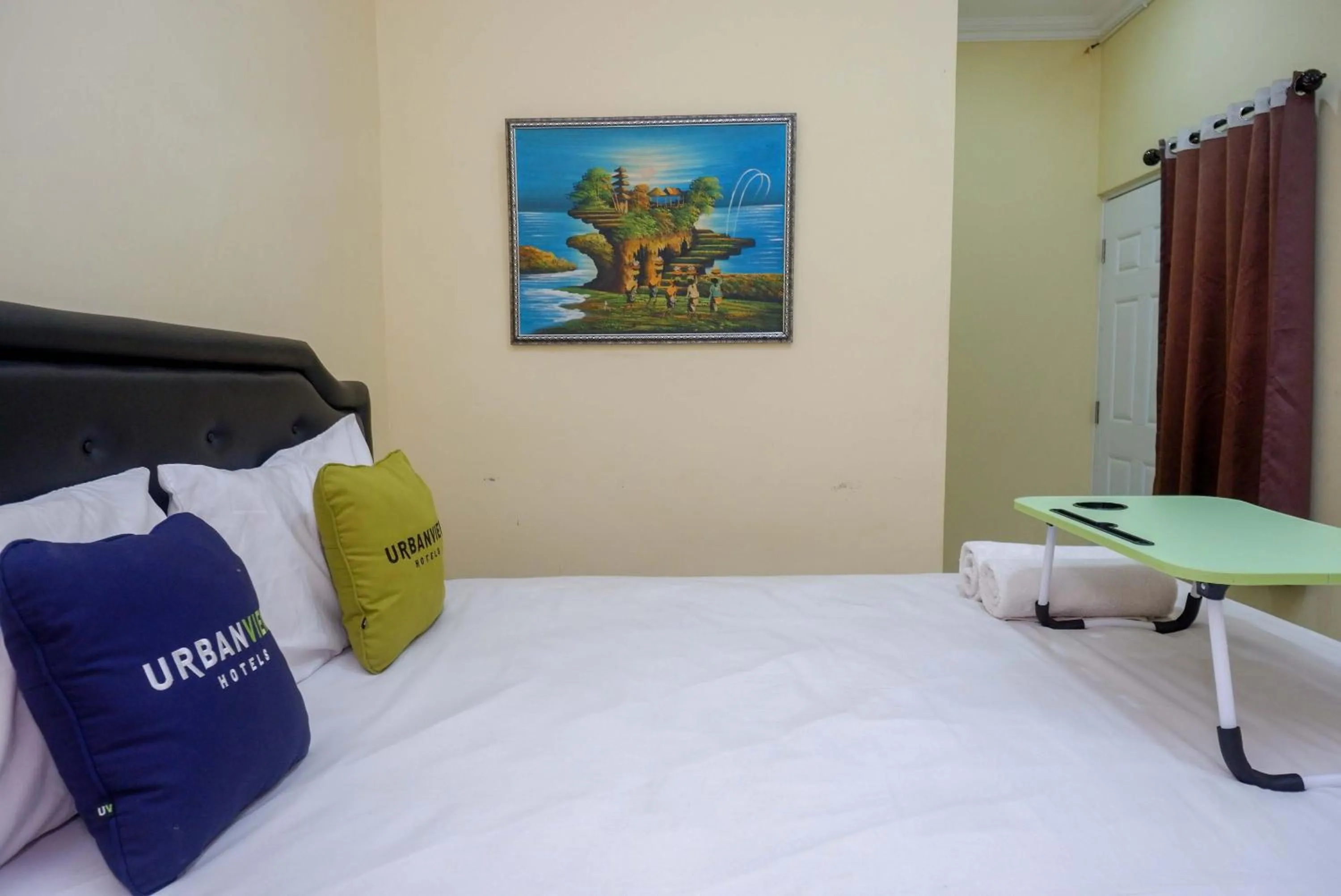 Photo of the whole room, Bed in Urbanview Hotel Jogja City Mall