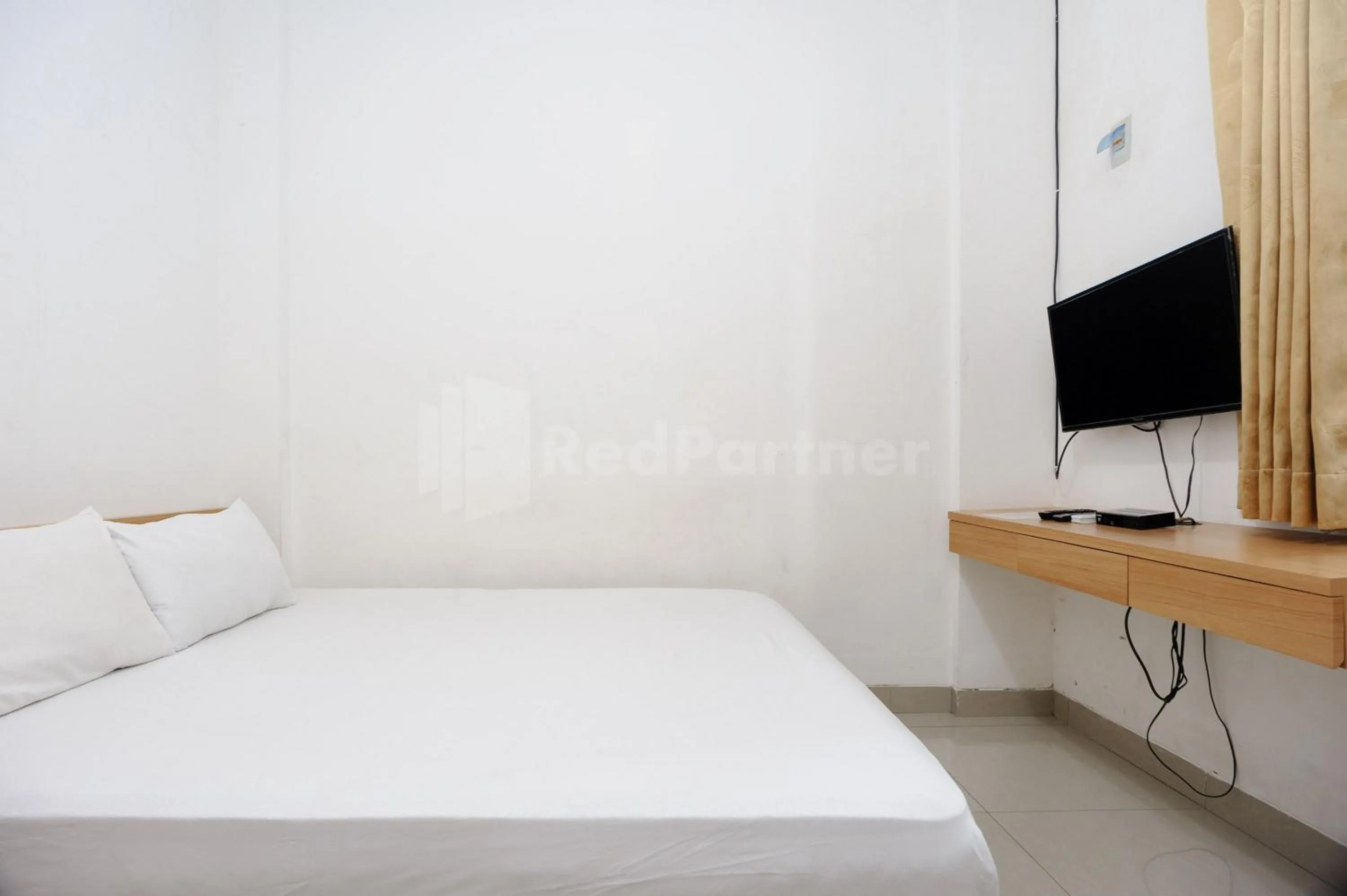 Bed in Family Residence Mitra RedDoorz