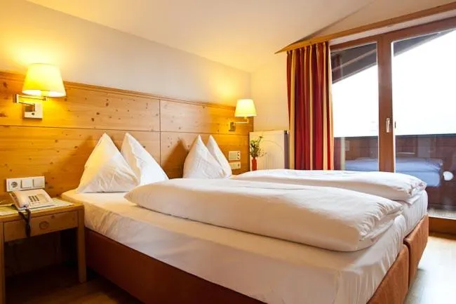 Bed in Hotel Gasthof Mitteregger - BEST PLACE in town with summercard included