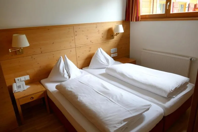 Bed in Hotel Gasthof Mitteregger - BEST PLACE in town with summercard included