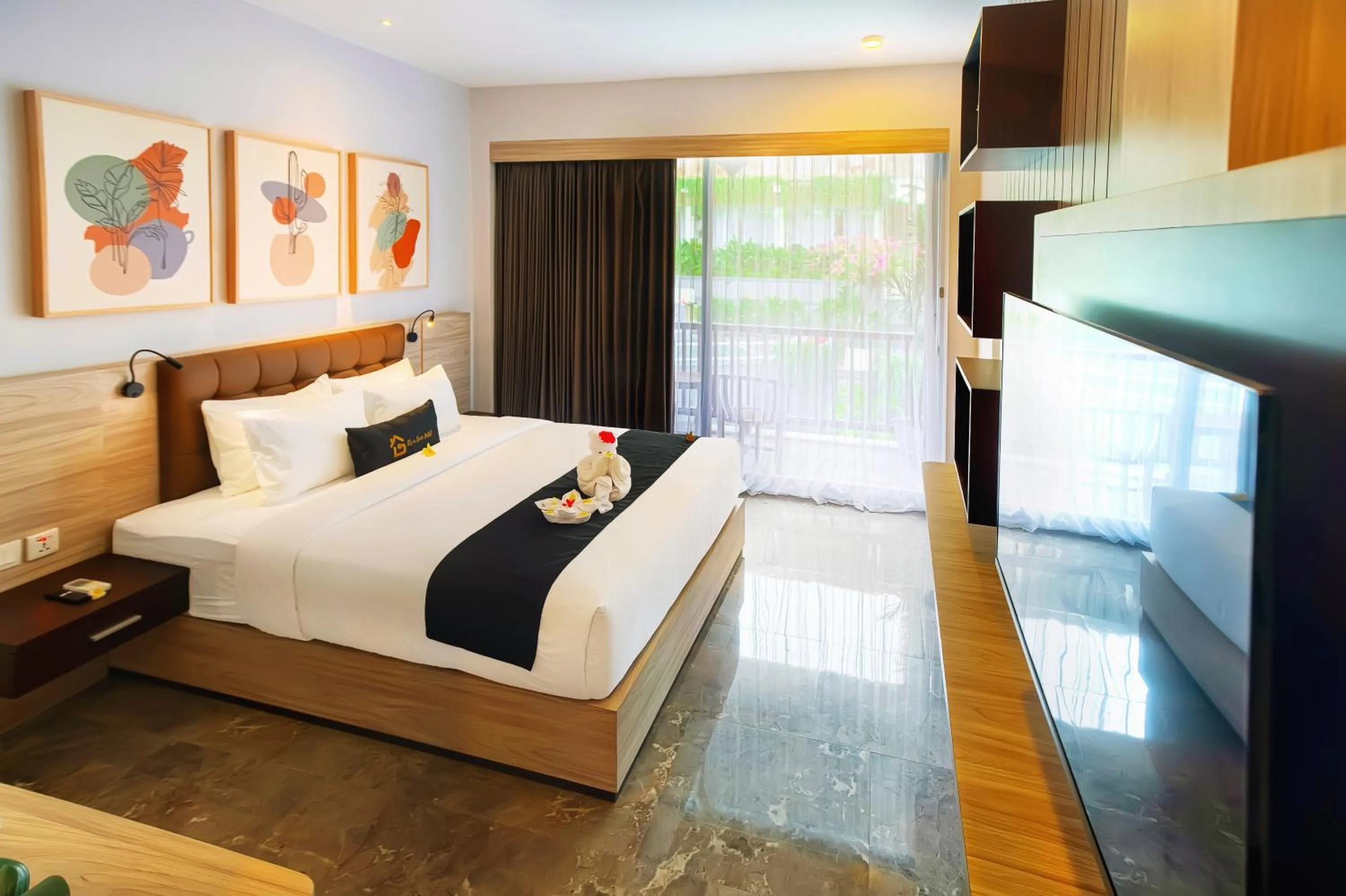TV and multimedia, Bed in Graha Socio Hotel Nusa Dua Bali