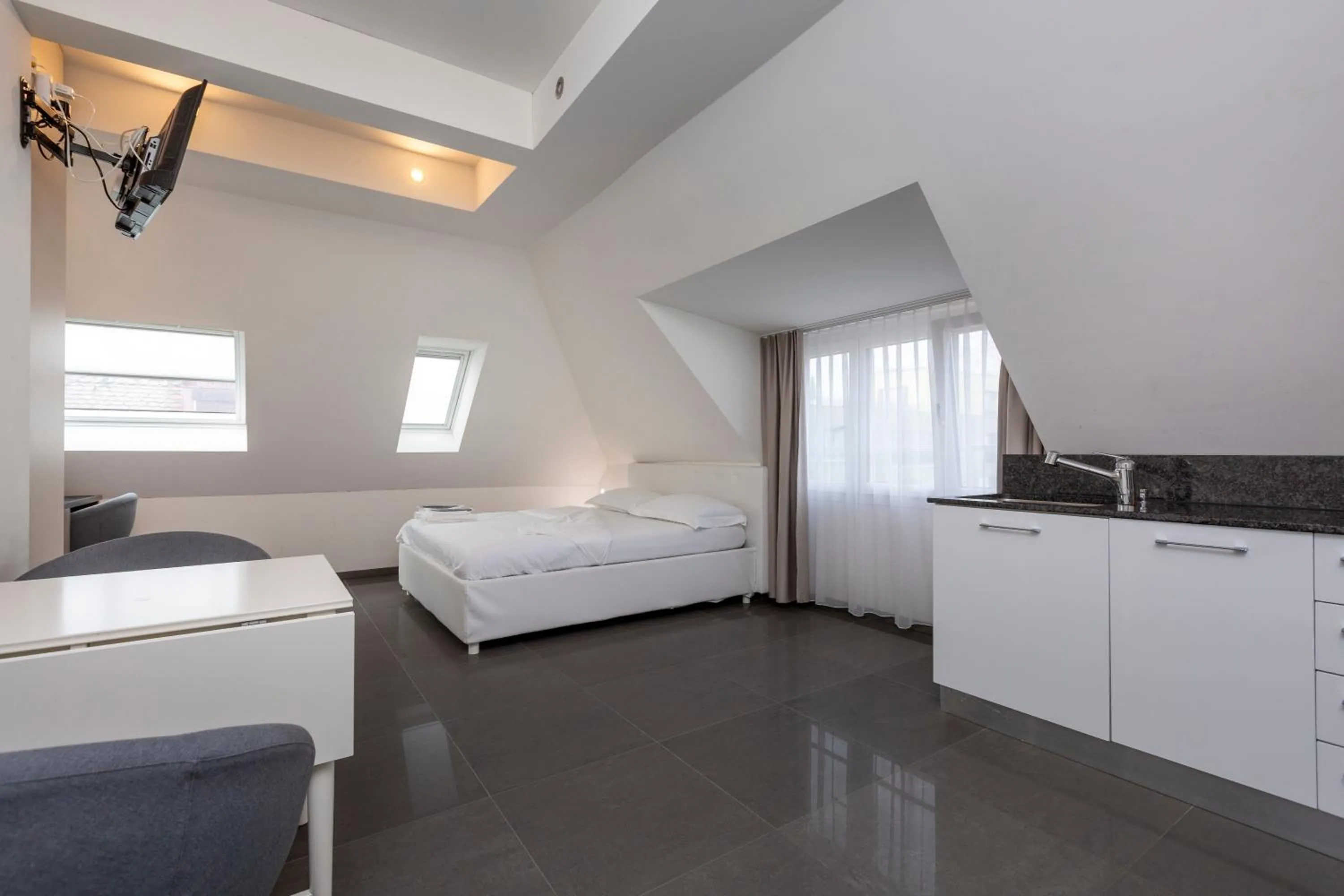 Kitchen or kitchenette, Bed in Hotel Kernhof Self Check-In