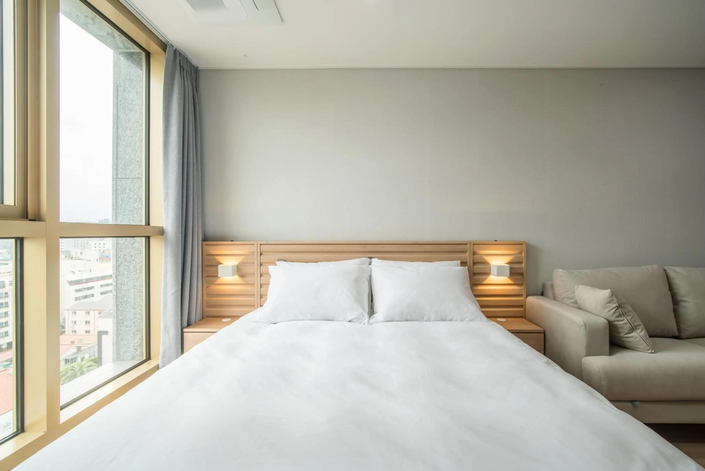 Bed in Jeju Central Park Residence