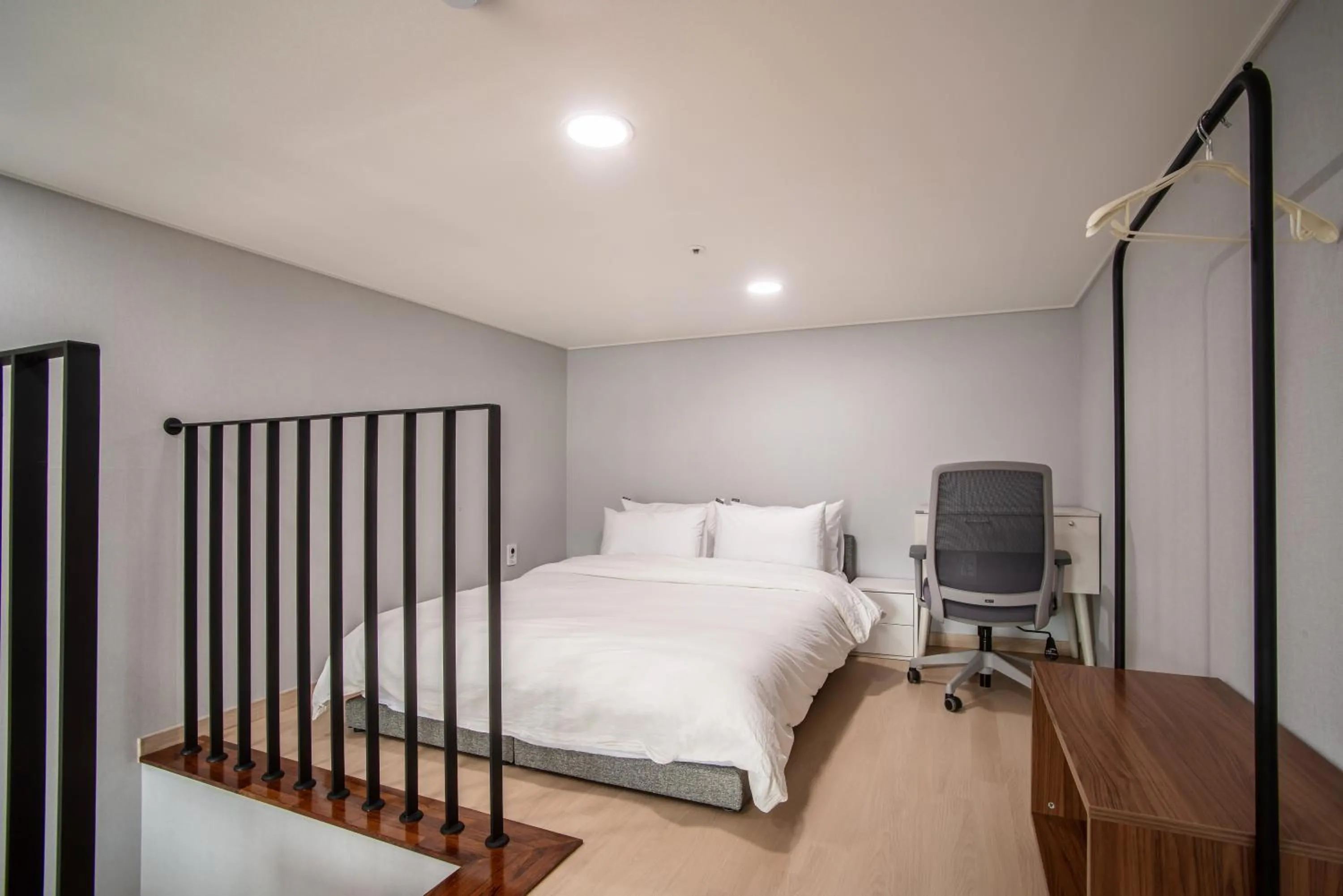 Bed in Jeju Central Park Residence