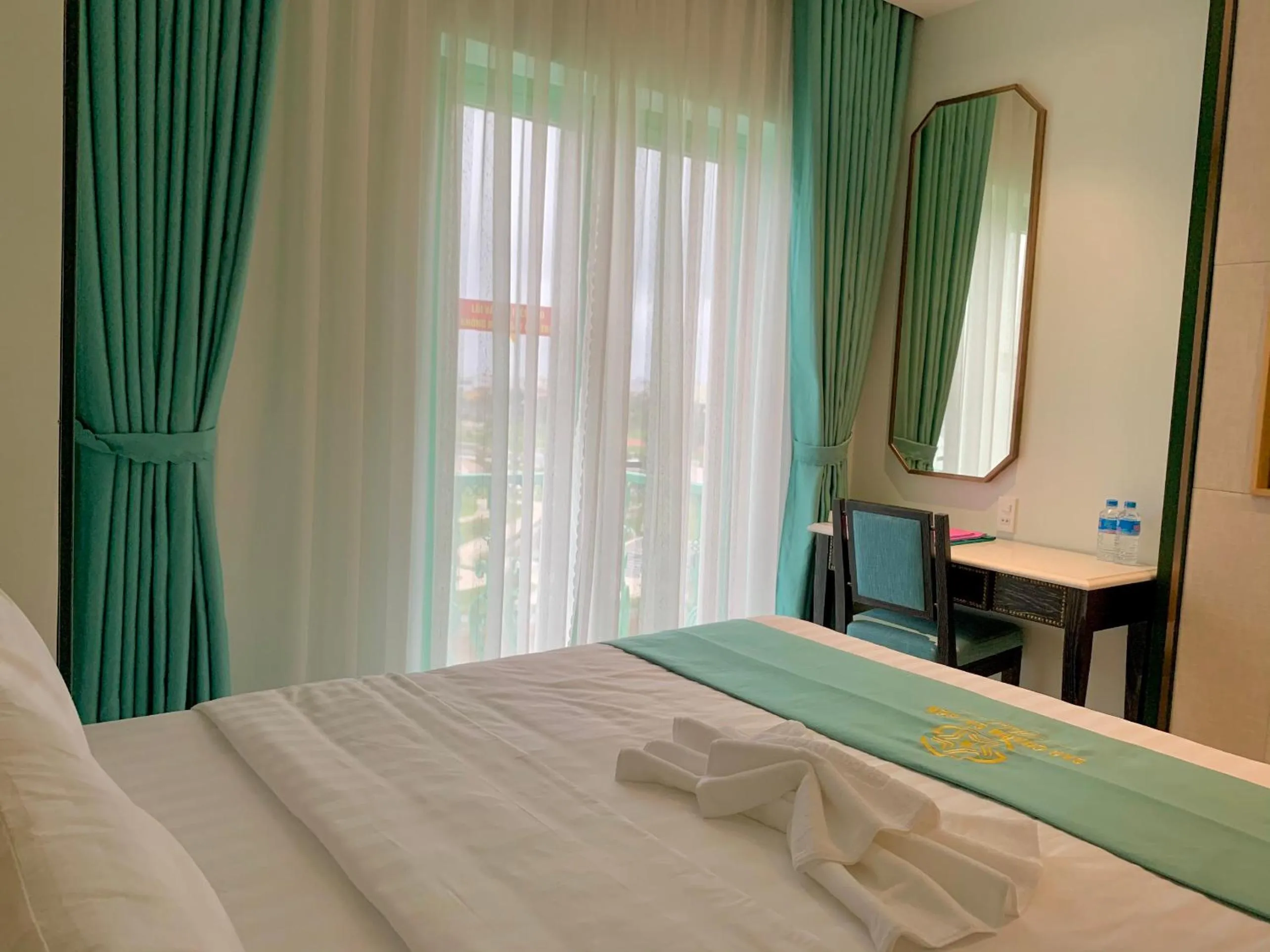 Bed in Sao Charm Sài Gòn Hotel