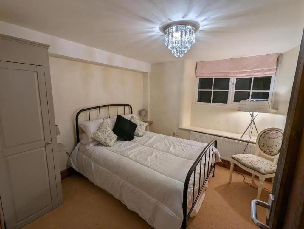 Bedroom in The Rising Sun Inn