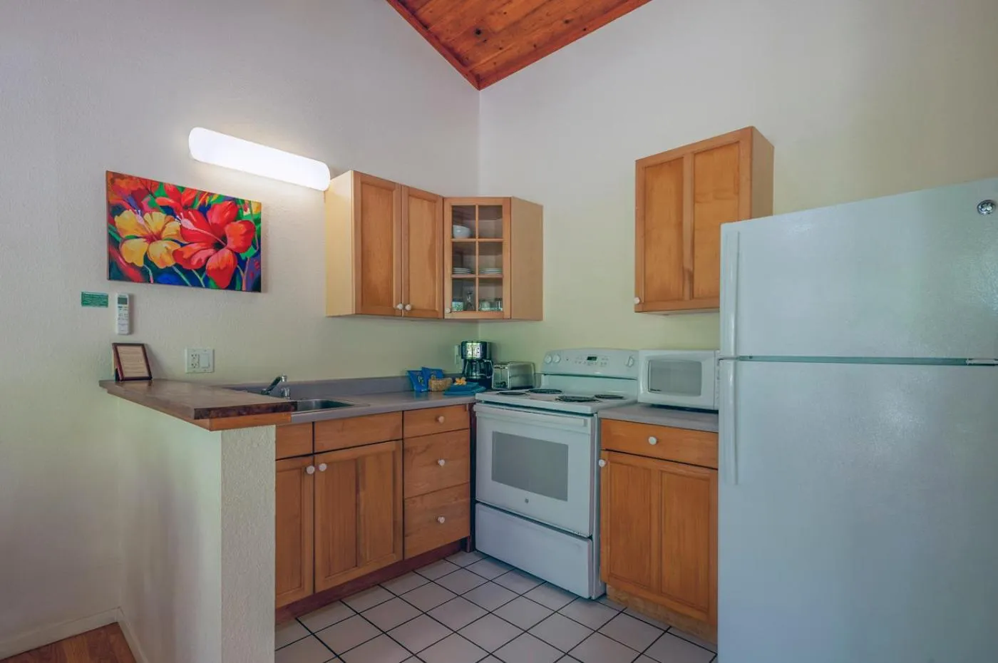 Kitchen or kitchenette in Poipu Plantation Vacation Rentals