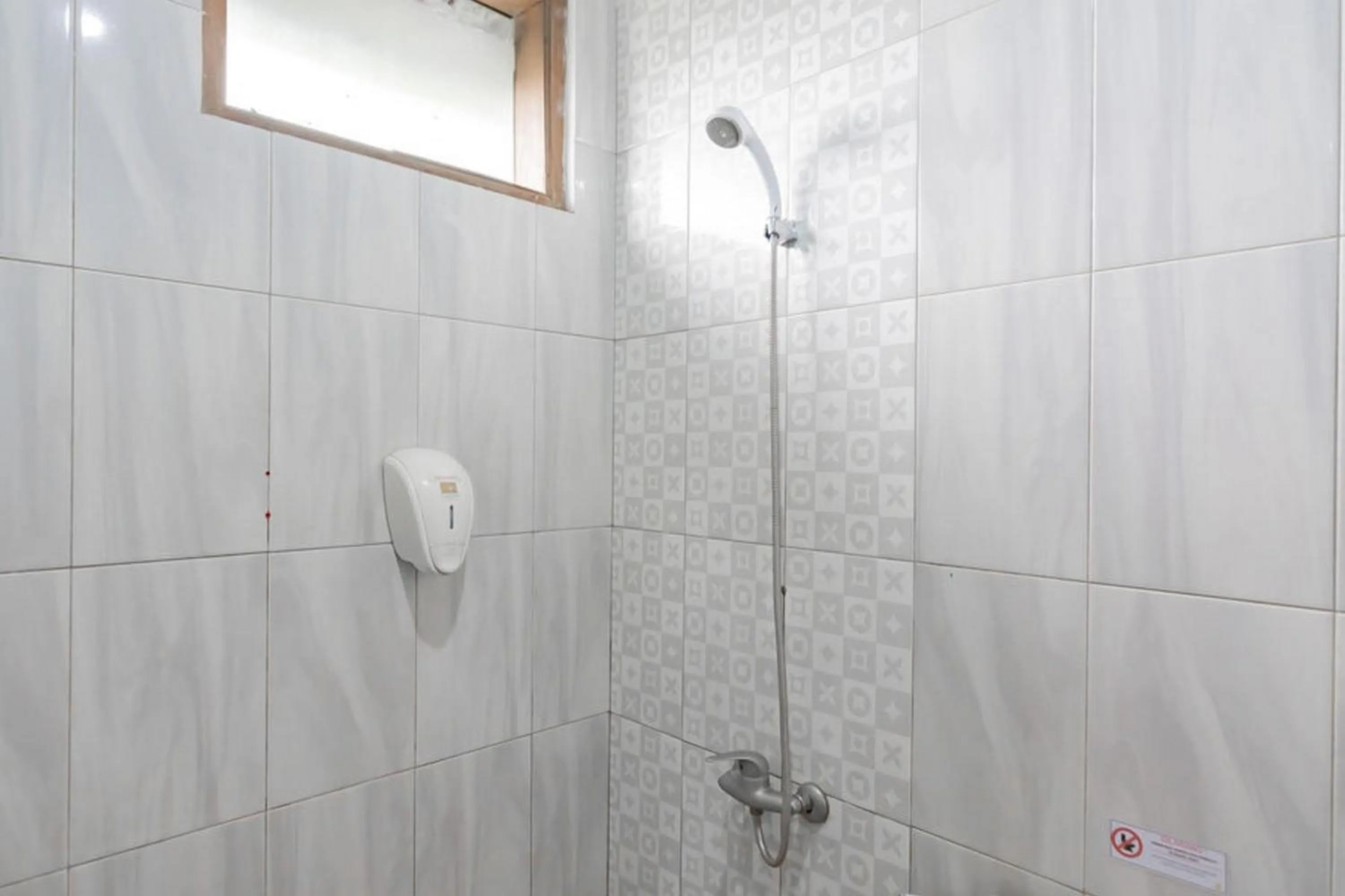 Bathroom in Sans Hotel Cihampelas Bandung