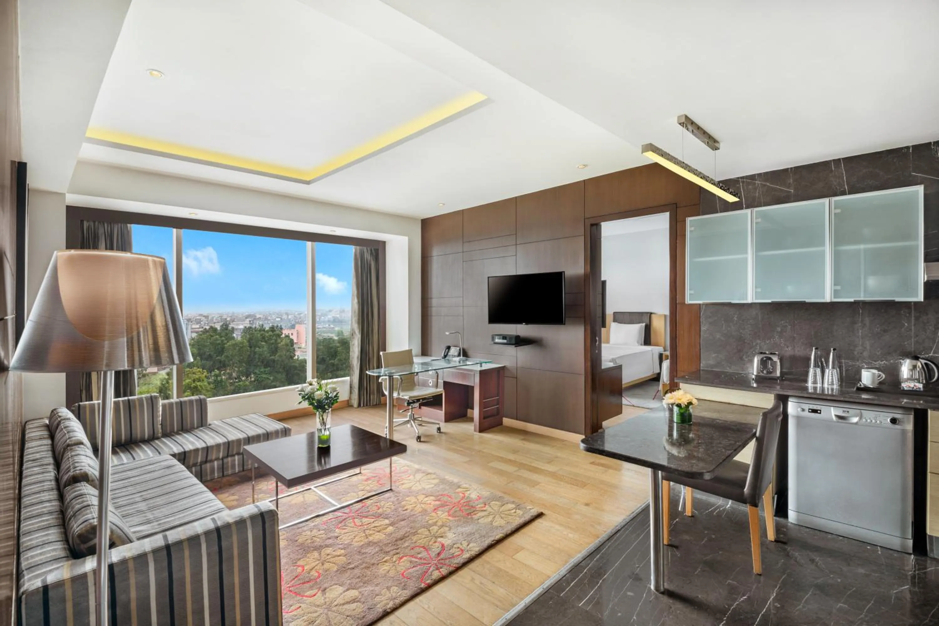 Communal lounge/ TV room in Crowne Plaza Greater Noida by IHG