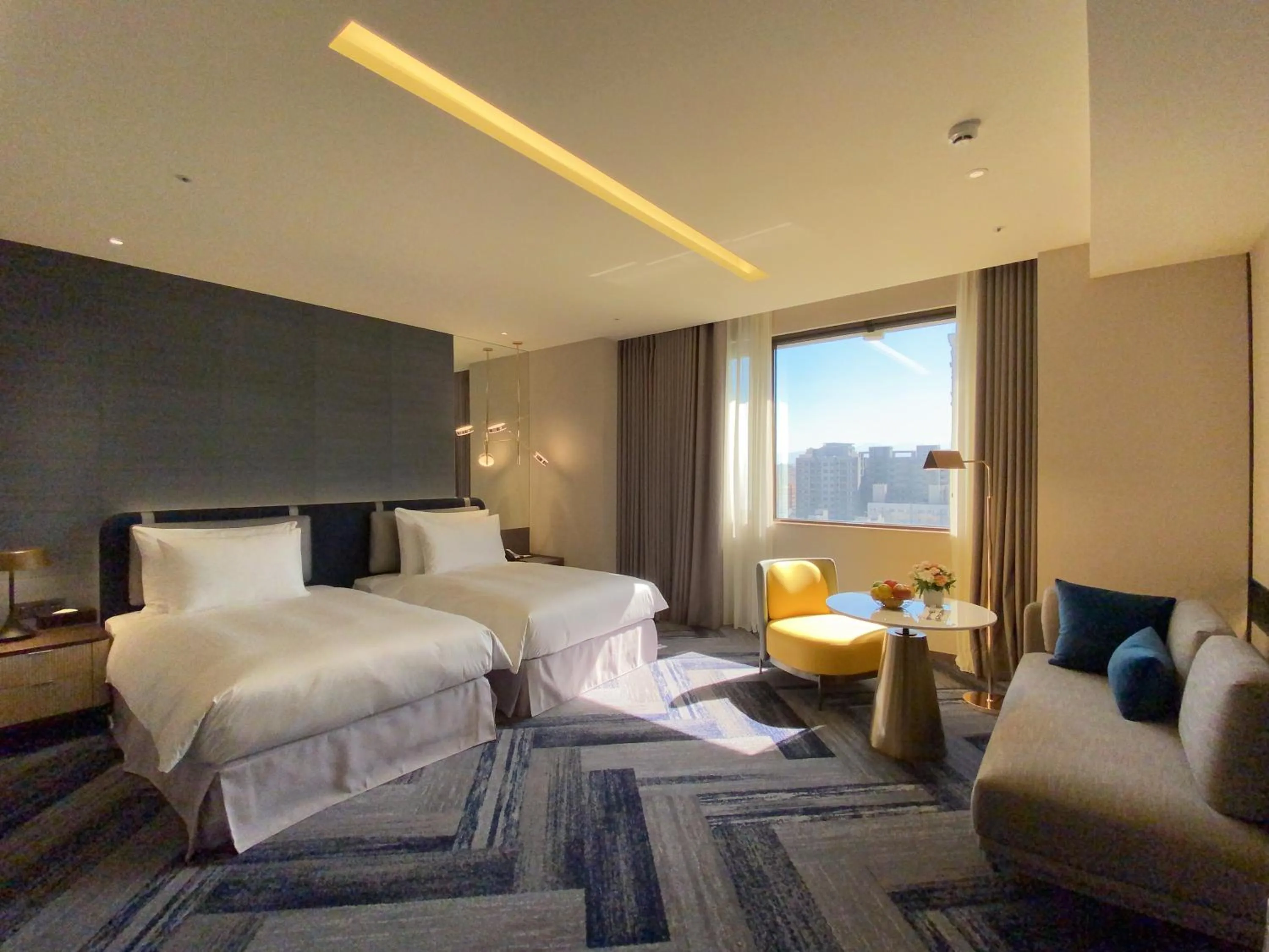 Bed in Monarch Plaza Hotel