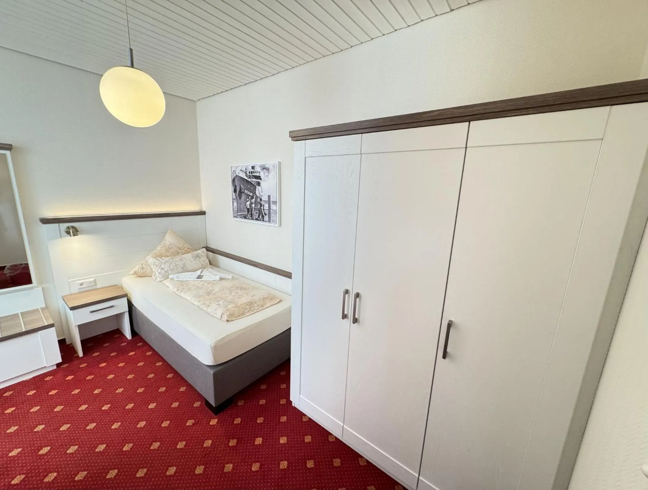 Photo of the whole room, Bed in Hotel Weisse Düne