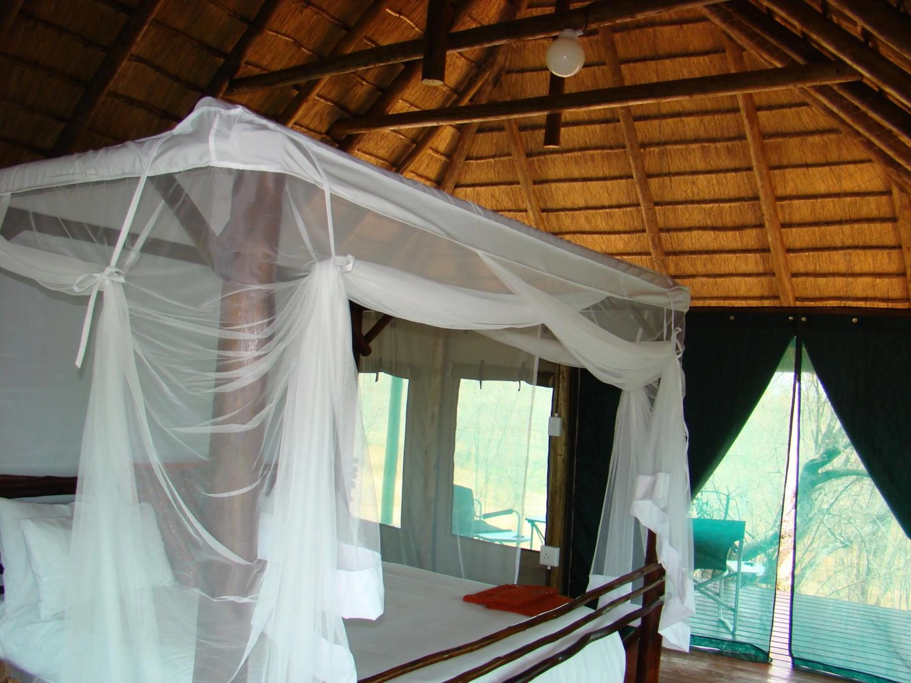 Bed in Muweti Bush Lodge
