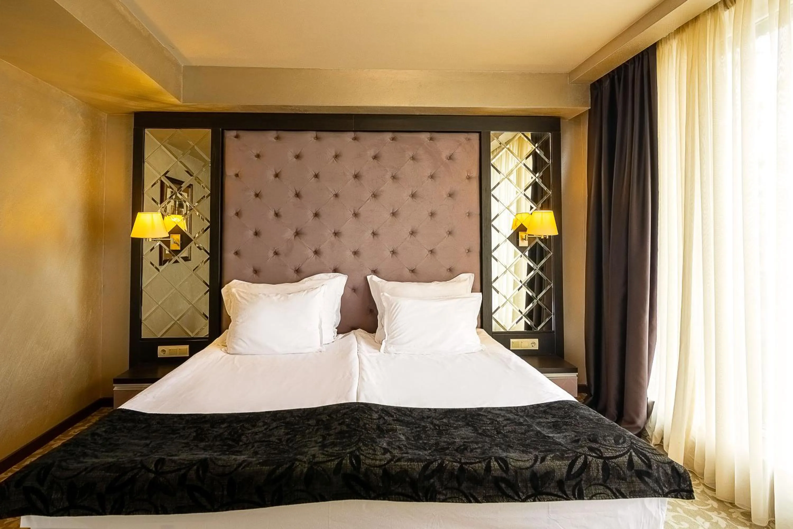 Bed in Royal Spa Hotel