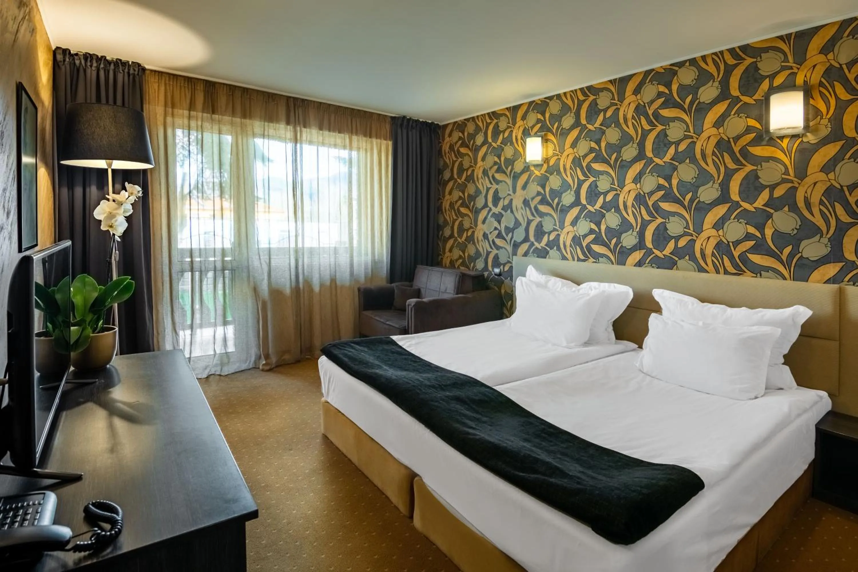 Bed in Royal Spa Hotel