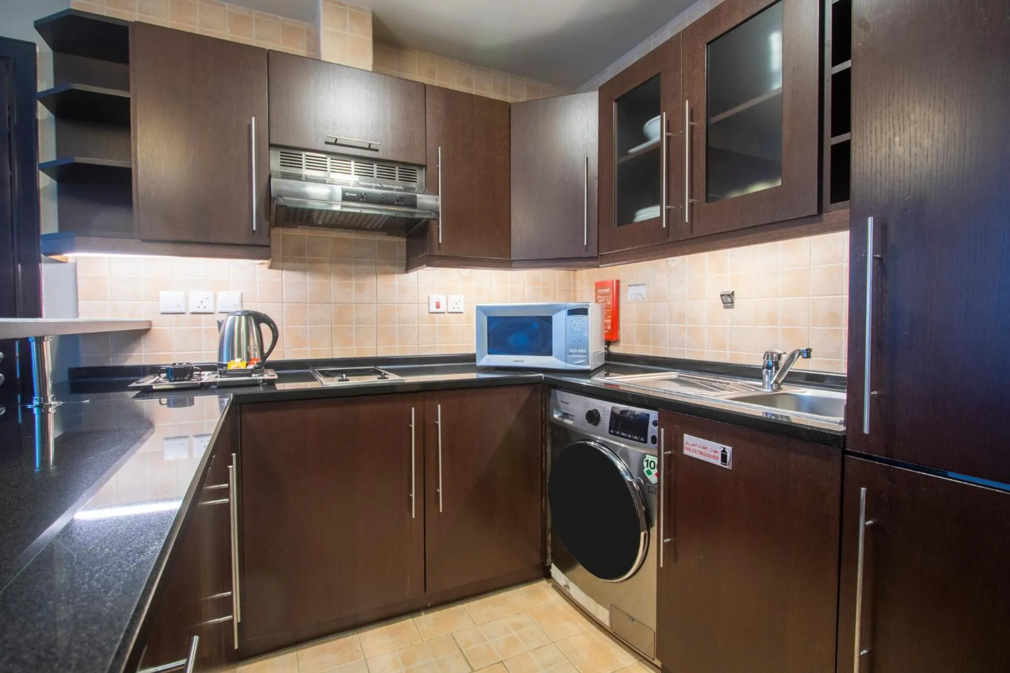 Kitchen or kitchenette in Al Manzel Hotel Apartments