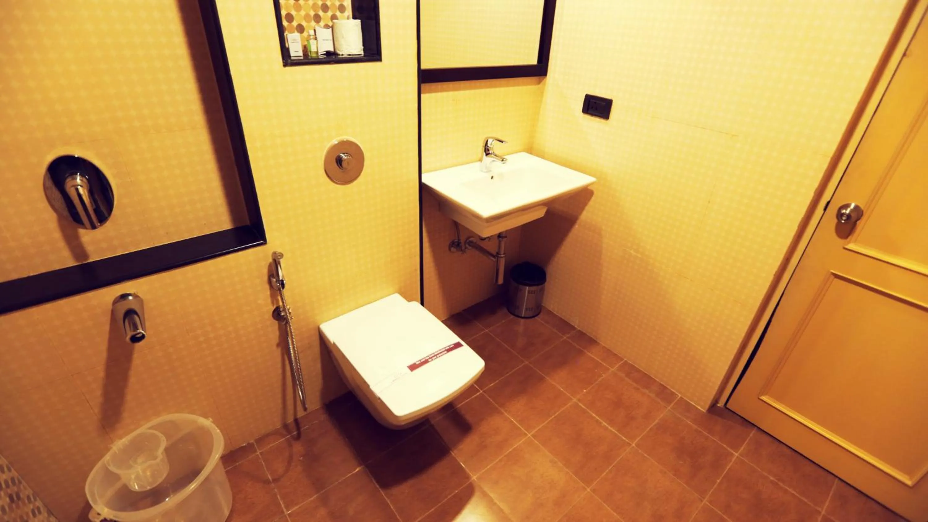 Bathroom in Lakshmi Hotel