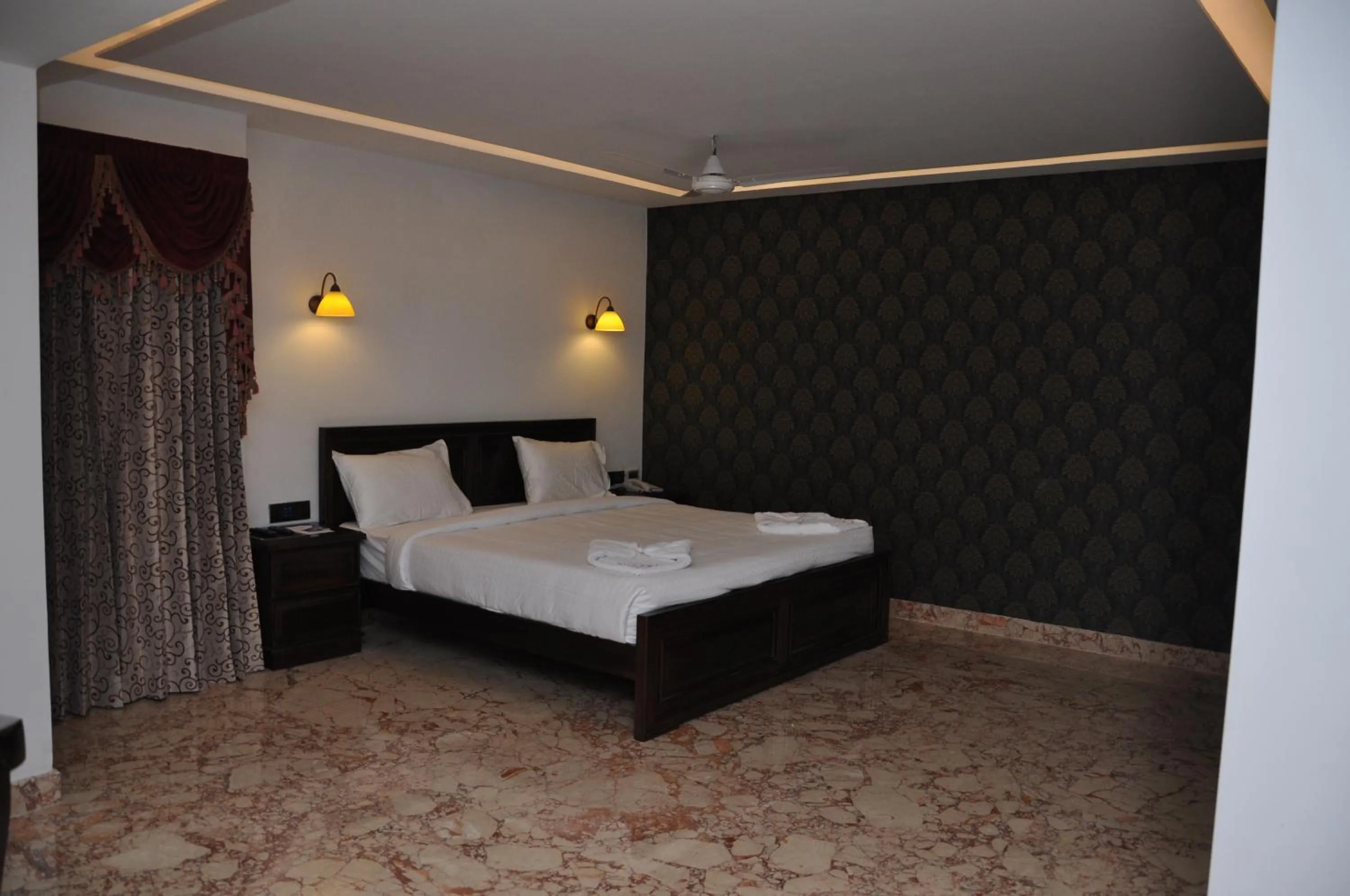 Bedroom in Lakshmi Hotel