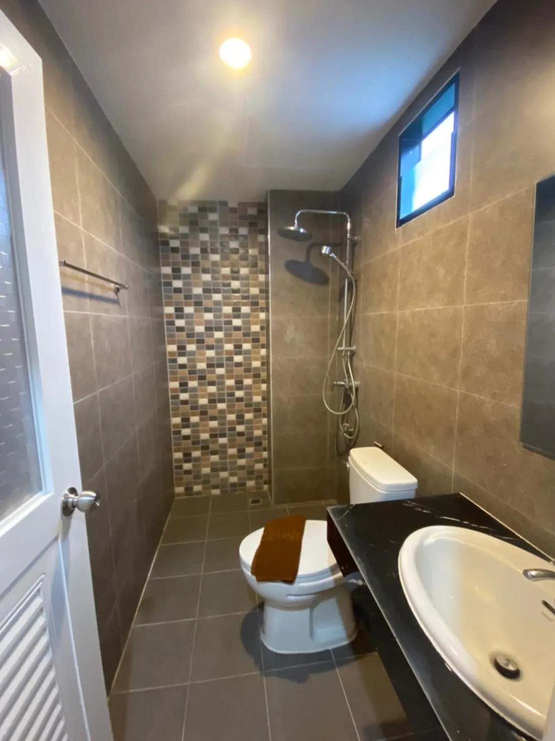 Shower in We Resident Hotel