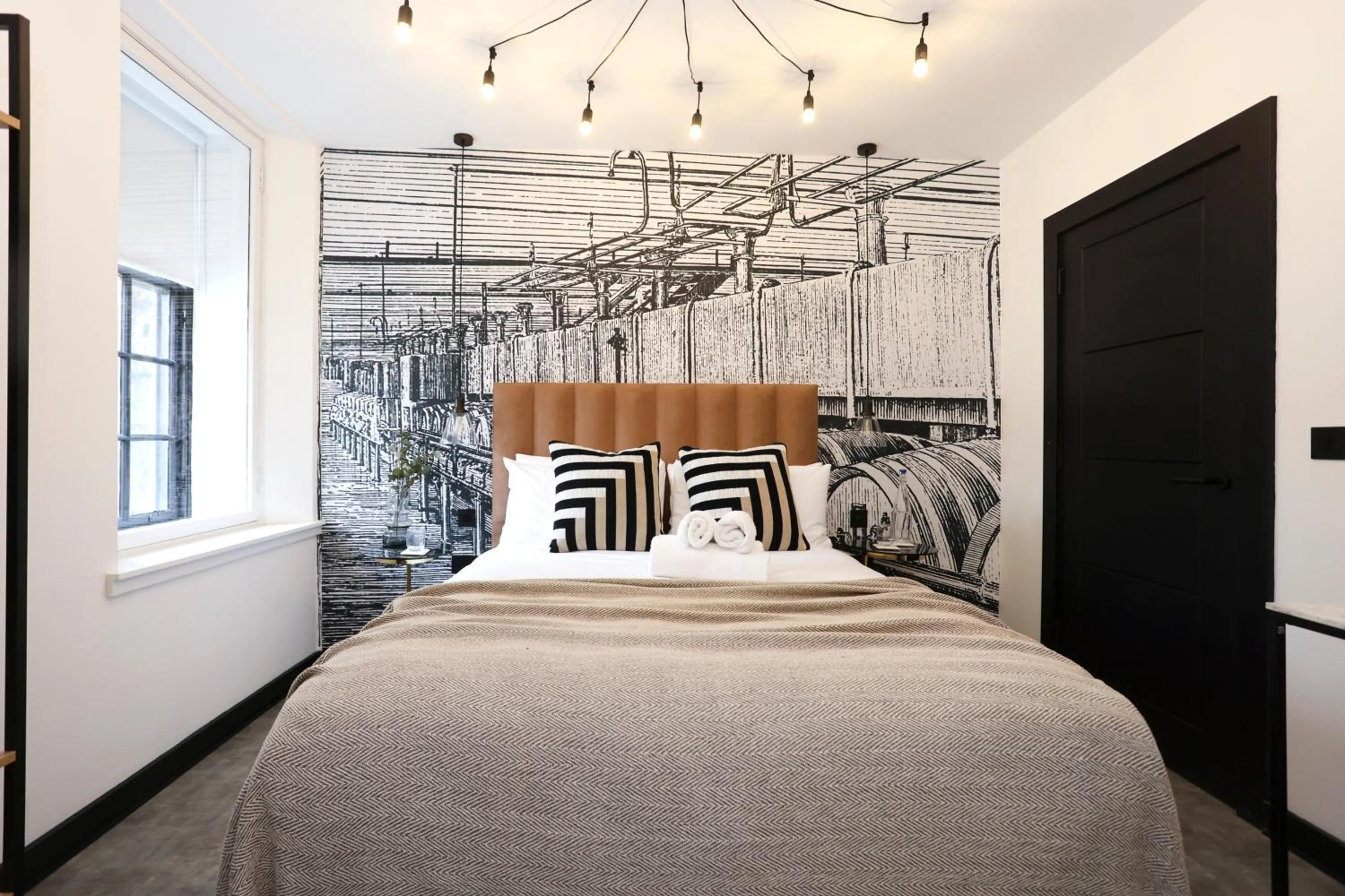 Bed in The Brewers Rooms Contemporary Aparthotel