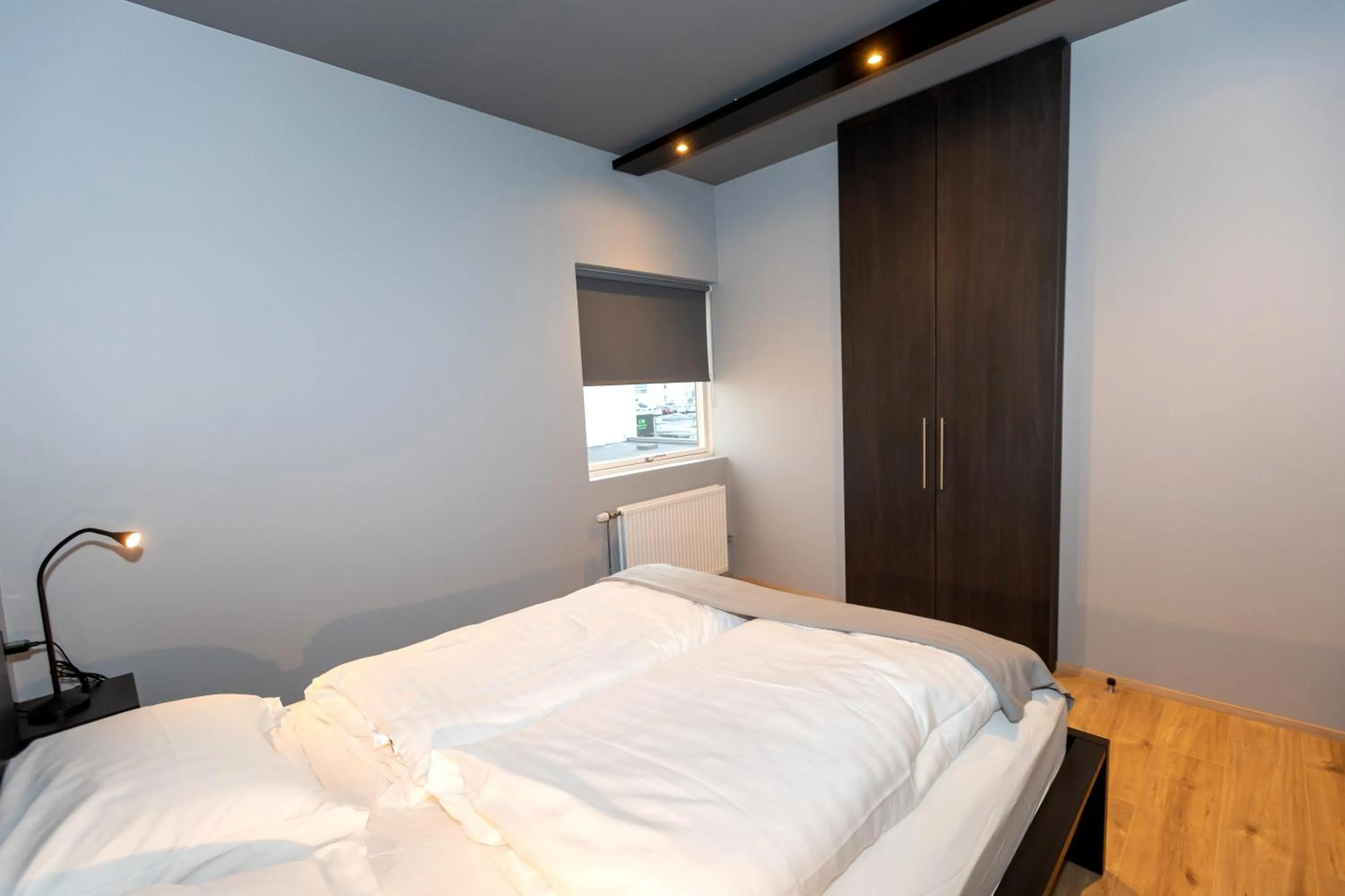 Bed in Akureyri Lux Apartments with hot tub access