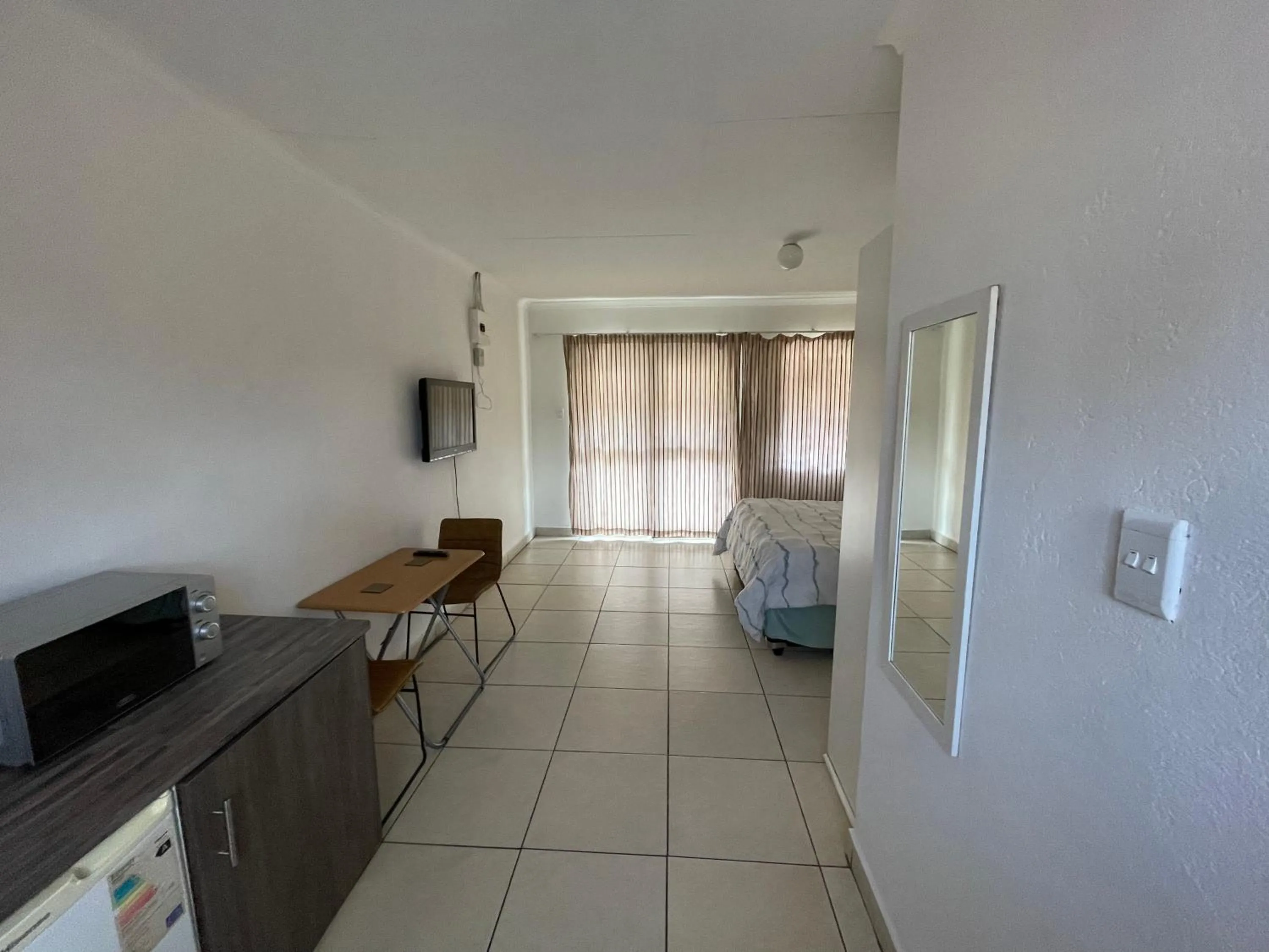 Communal lounge/ TV room in La Fiance Village