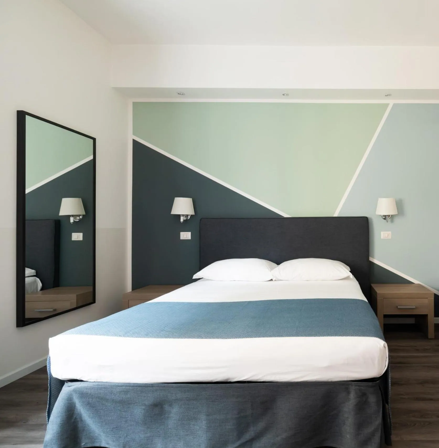 Bed in Fleming Suites by Hili