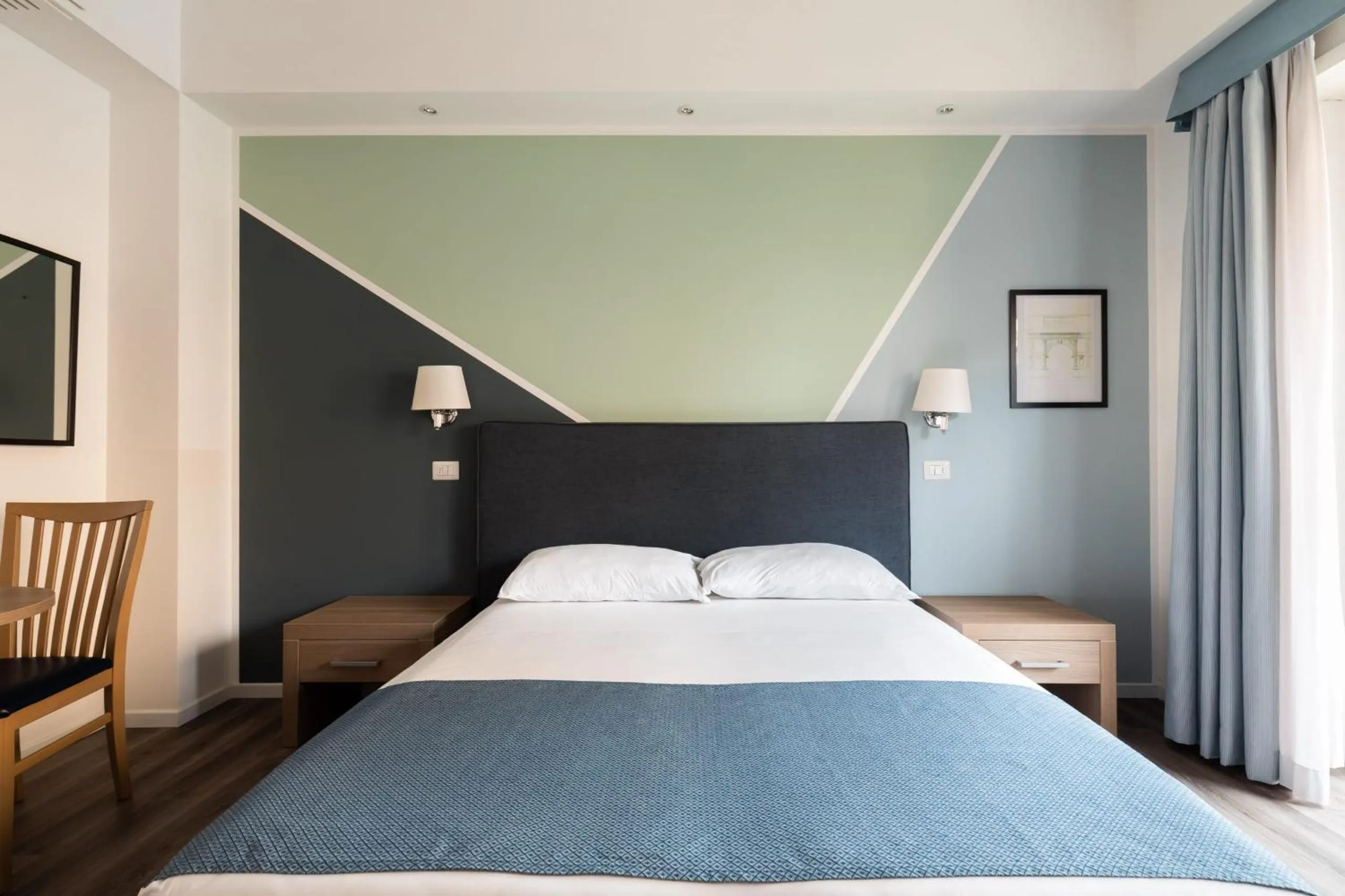 Bed in Fleming Suites by Hili