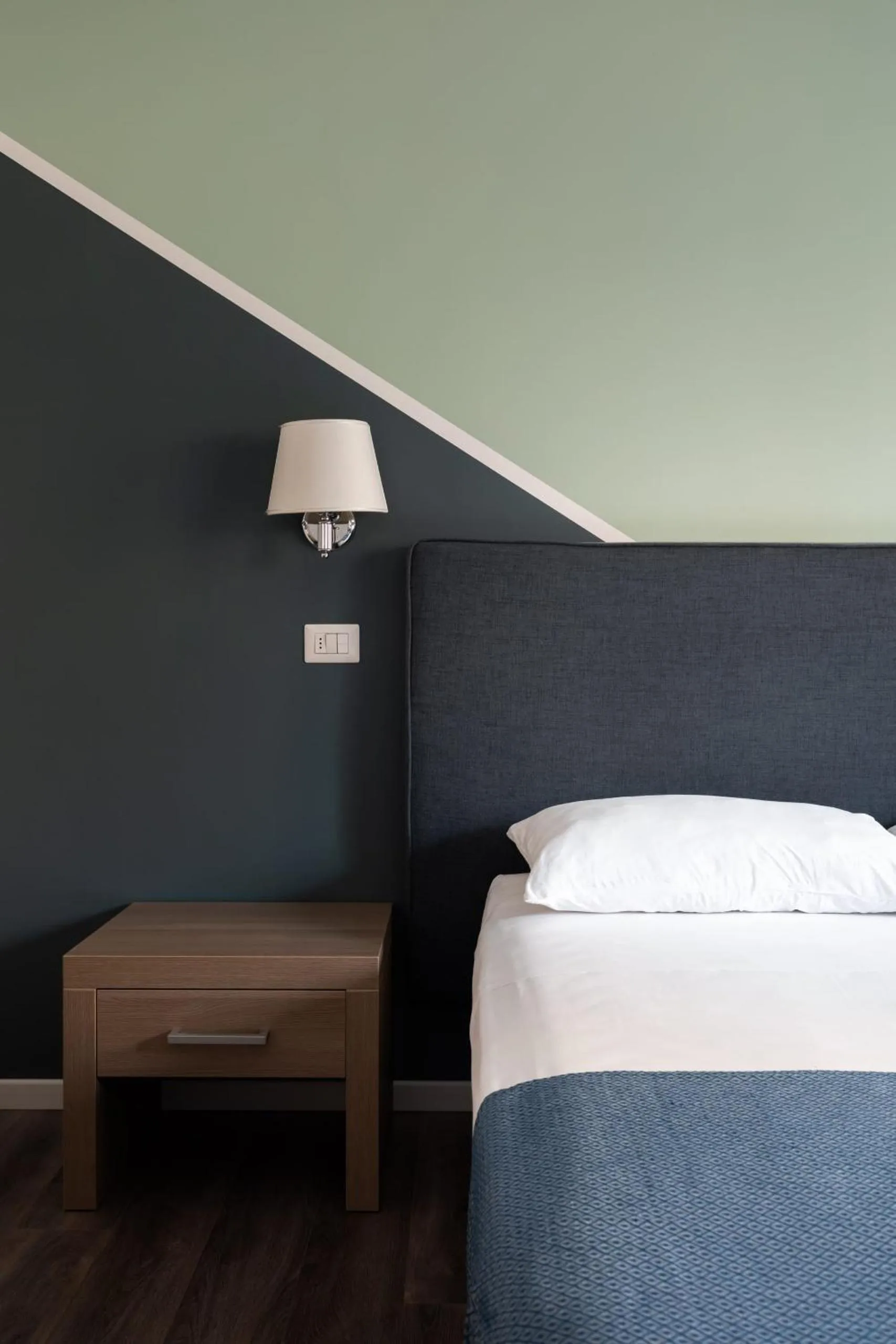 Bed in Fleming Suites by Hili