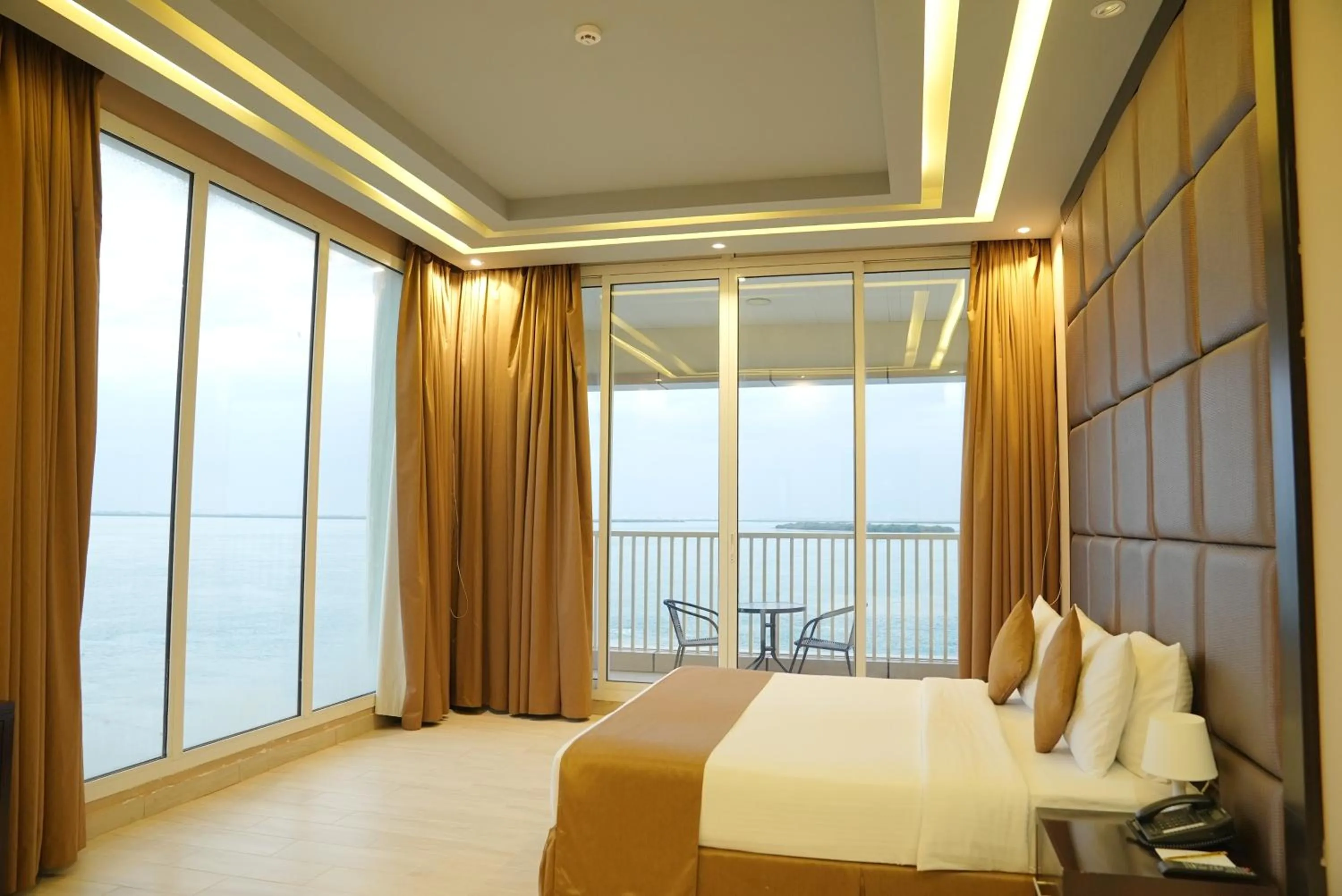 Bed in Flamingo Beach Hotel