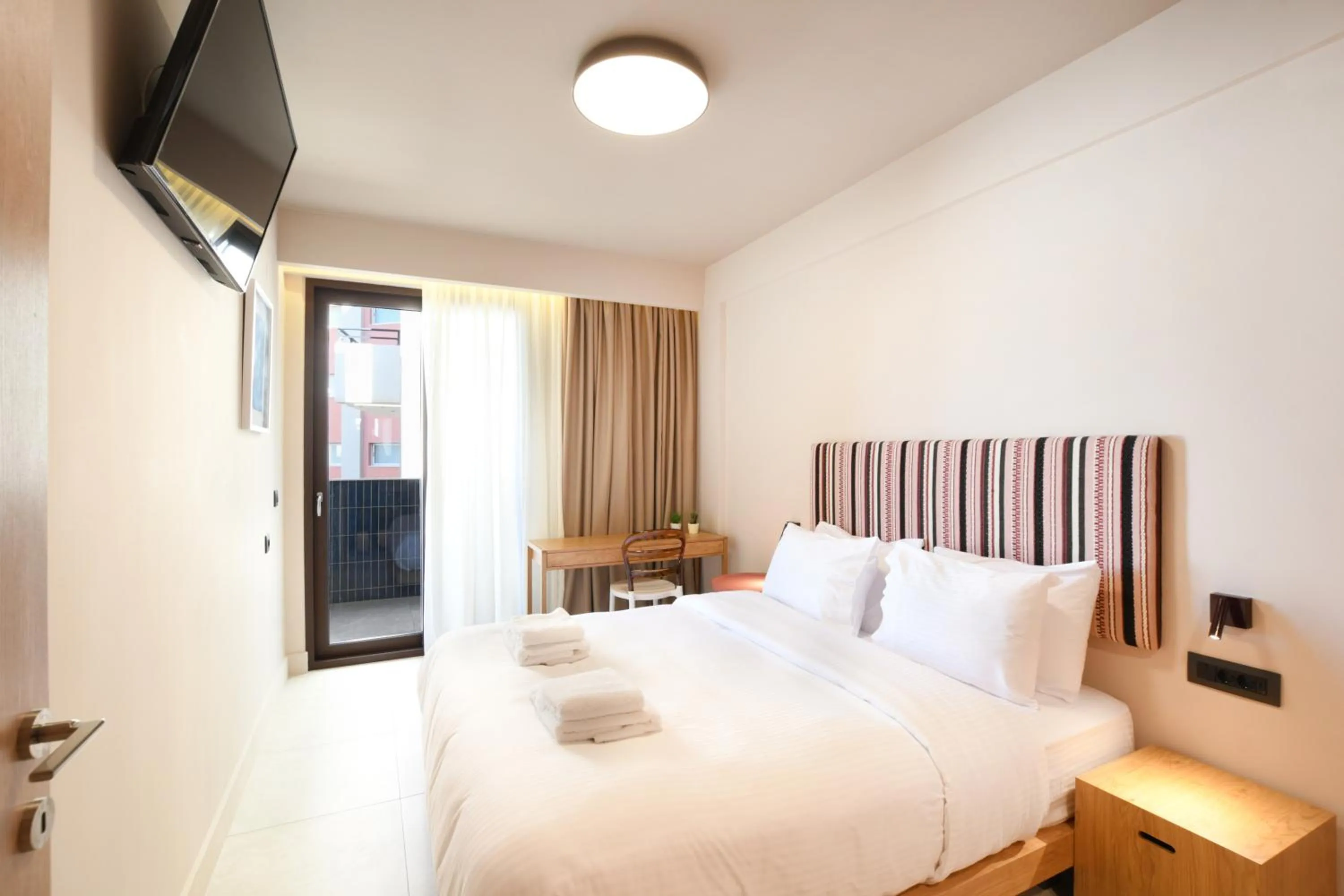 Bed in Pavo Art Hotel