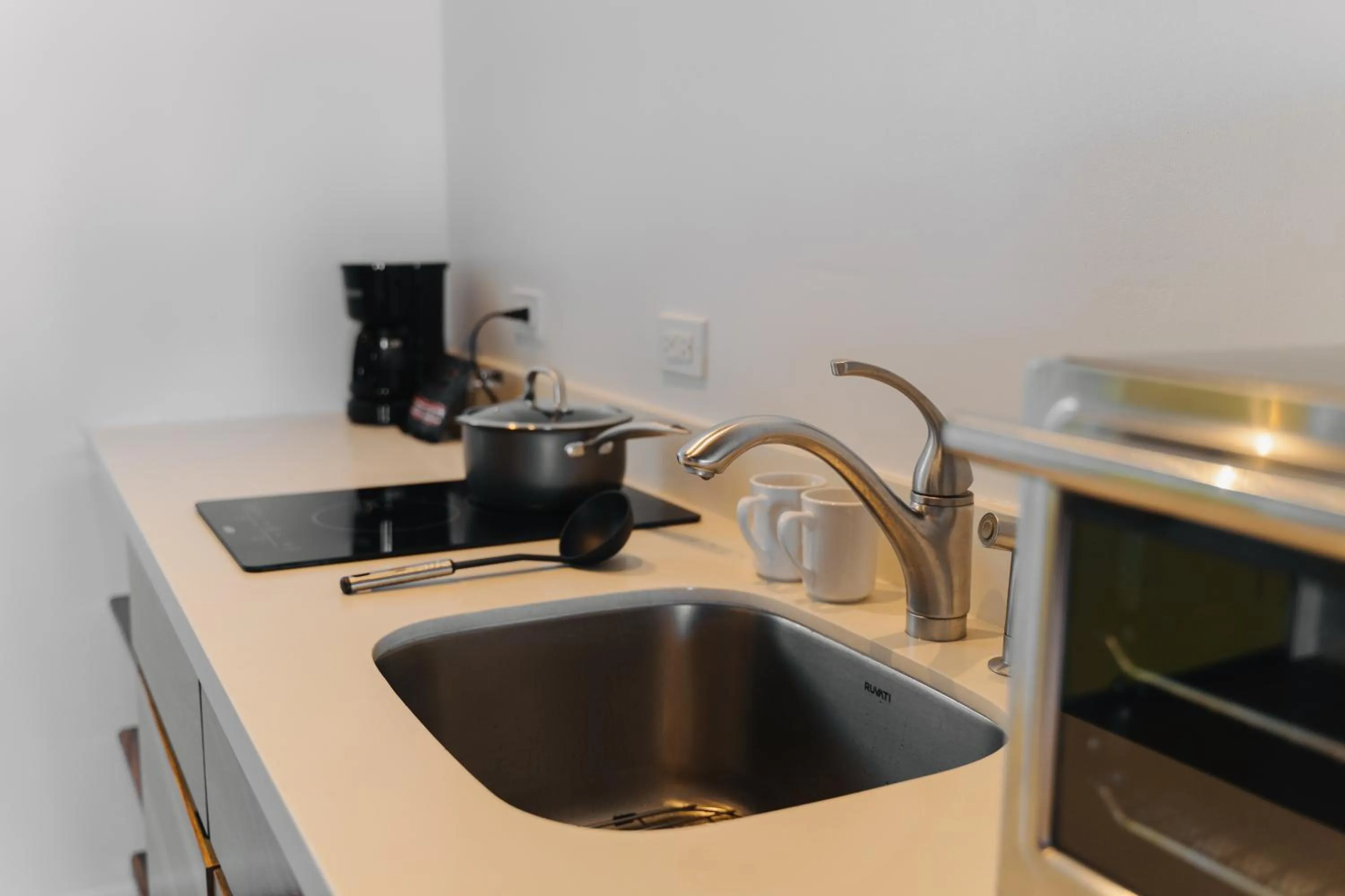 Kitchen or kitchenette in The Beach House Boutique Hotel