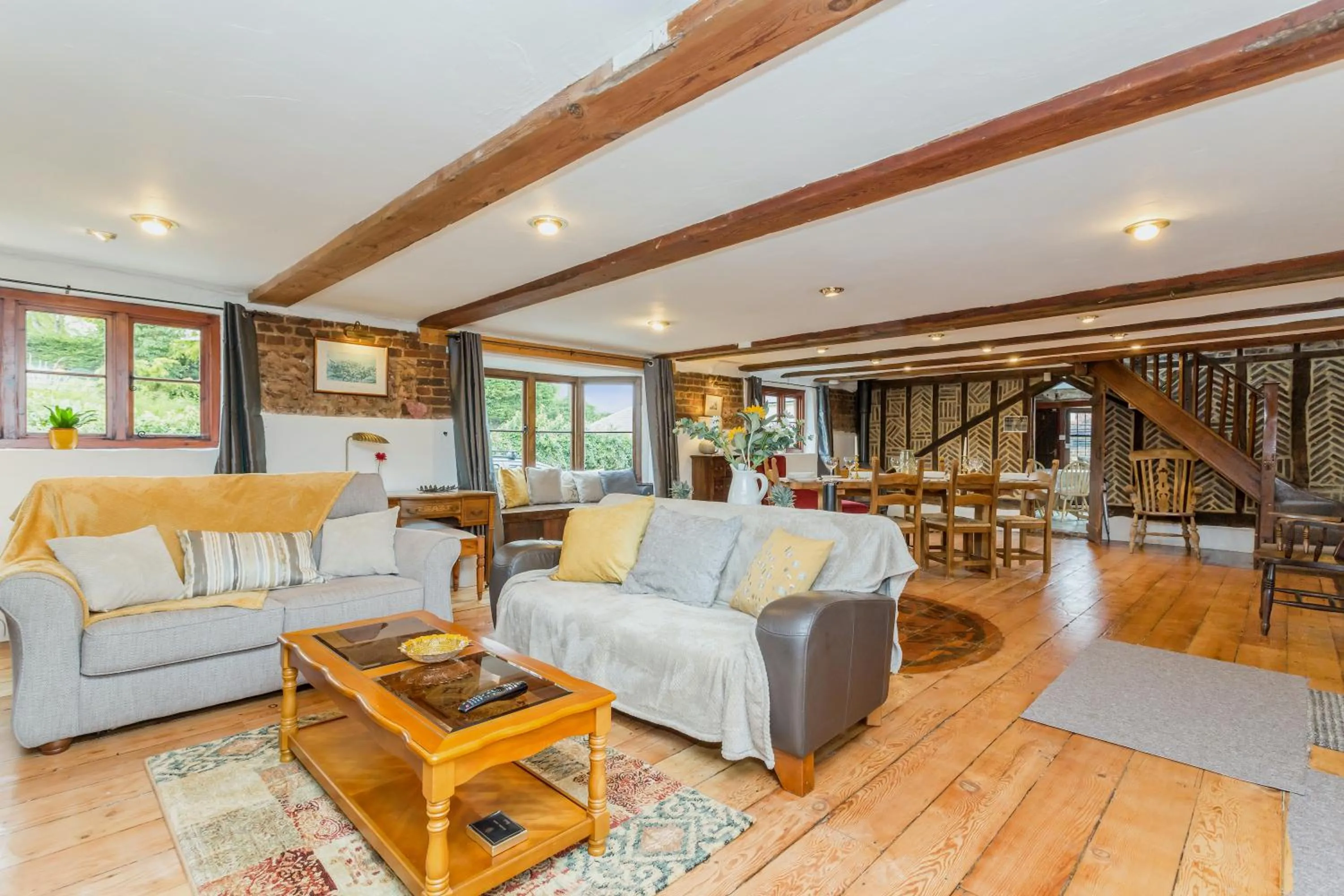 Living room in Dyke Farm Barn near Brighton by Huluki Sussex Stays