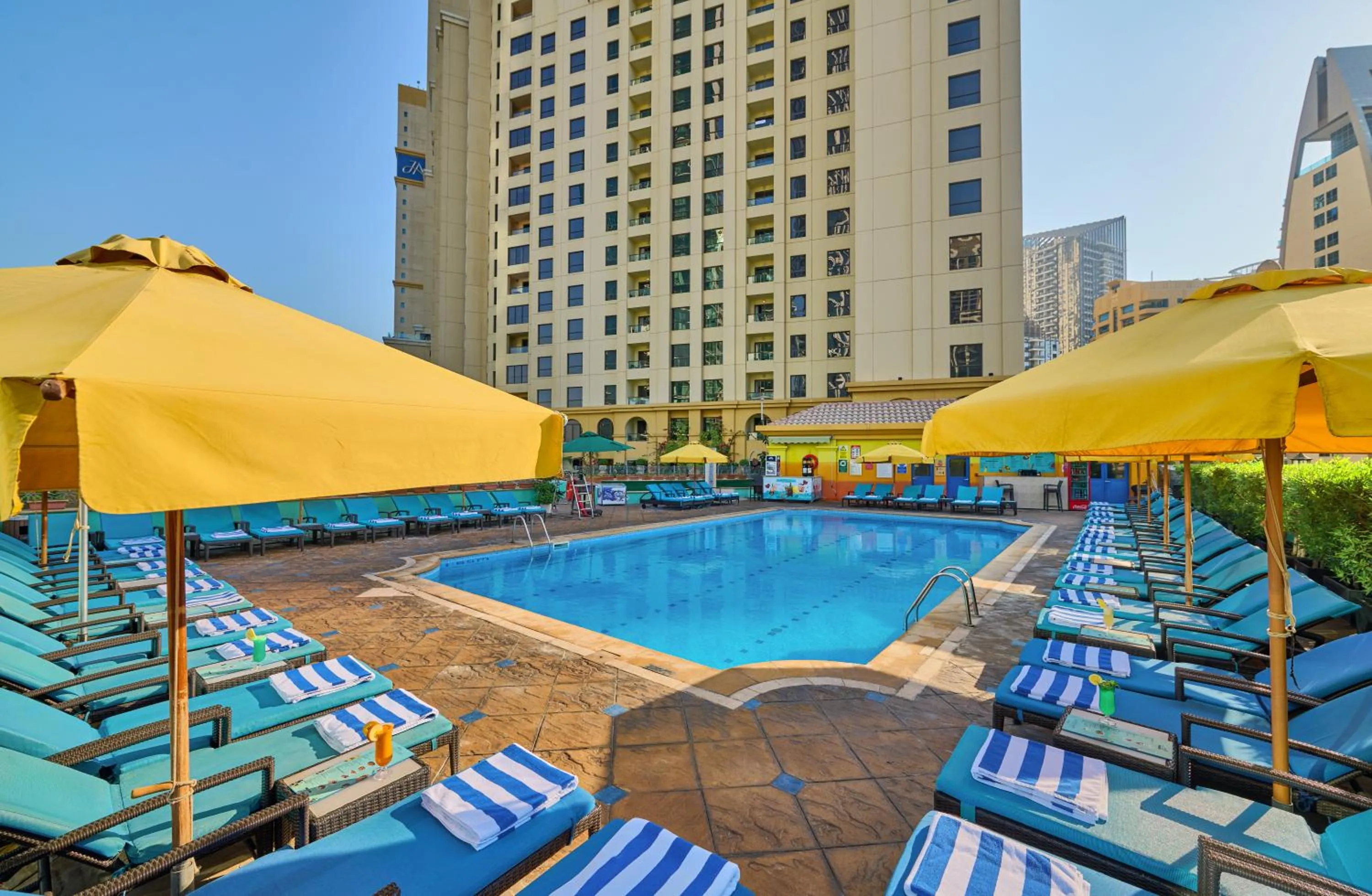 Swimming pool in Ramada Hotel, Suites and Apartments by Wyndham Dubai JBR