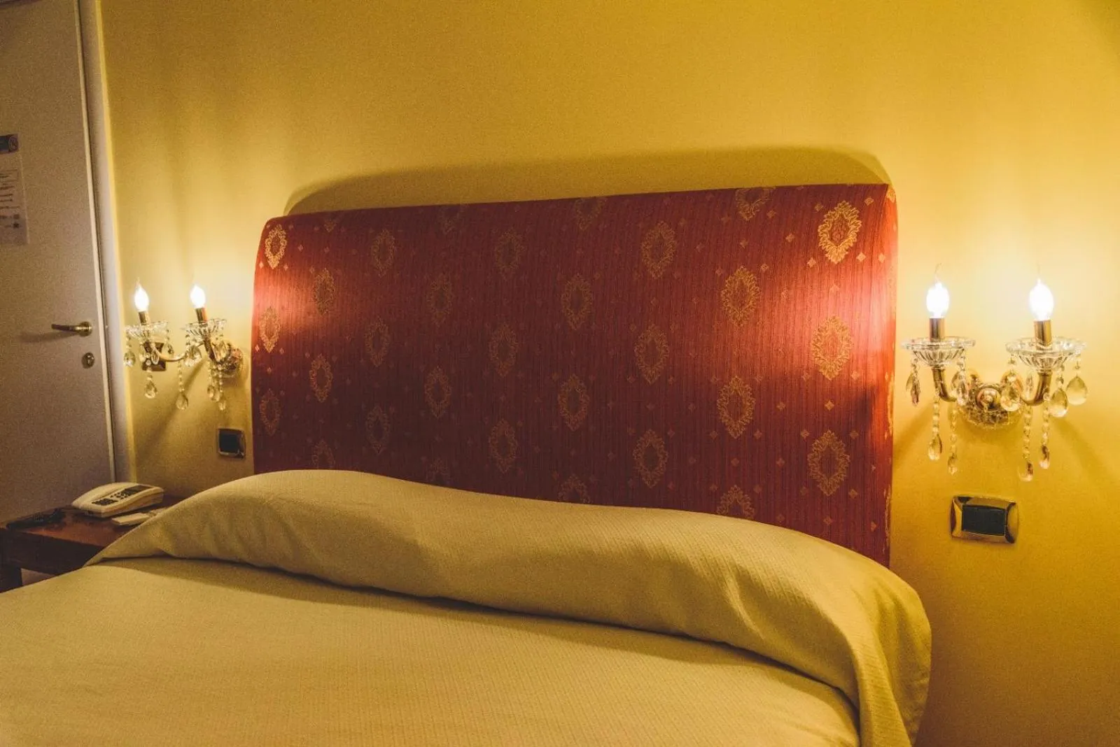 Bed in CANELLA HOTEL