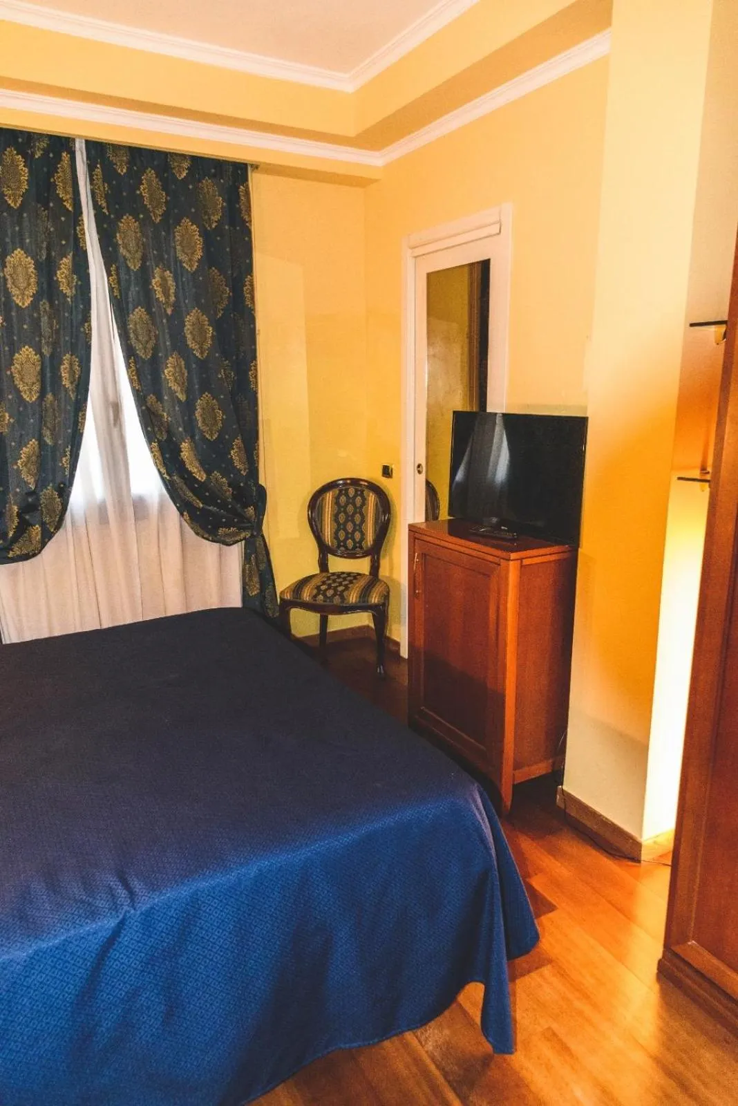 Bed in CANELLA HOTEL