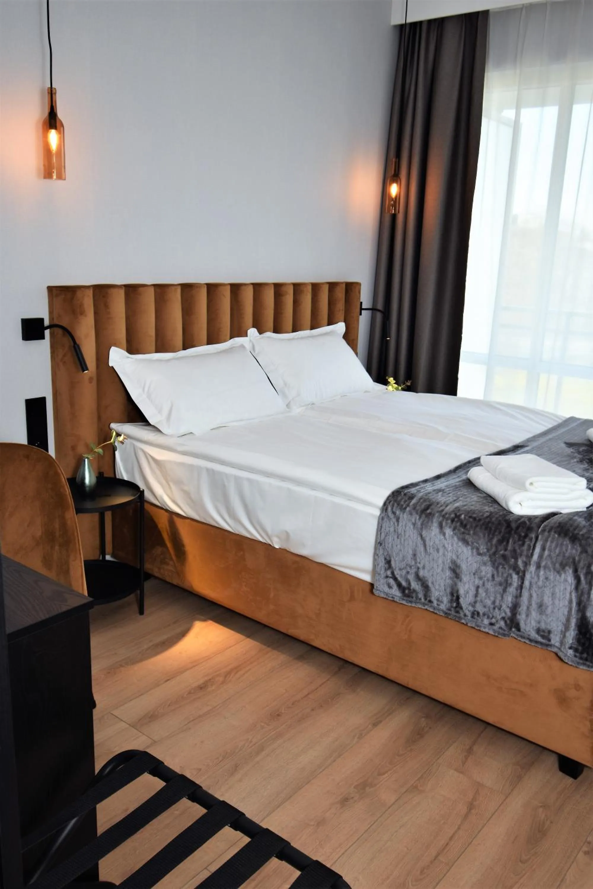 Bed in Patio Riverfront Aparthotel