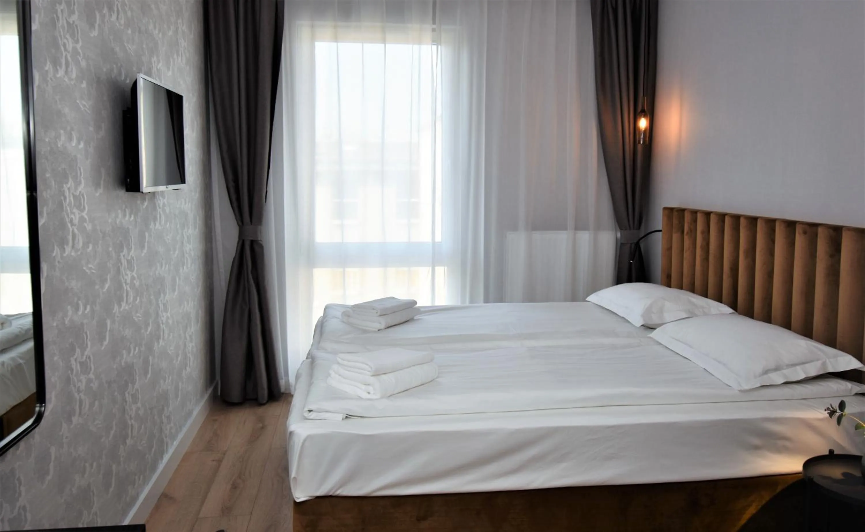 Bed in Patio Riverfront Aparthotel