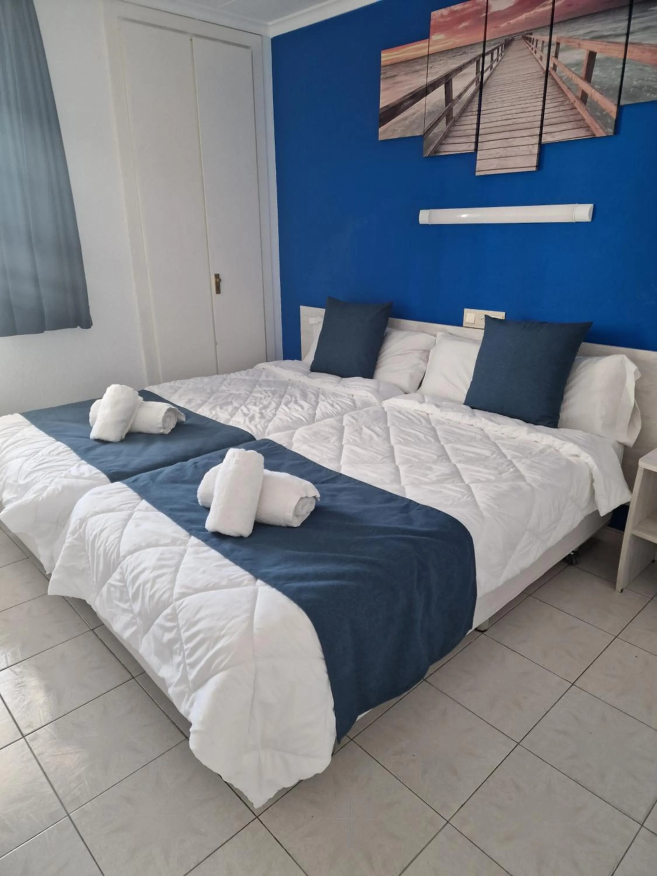 Bed in Europa Family Apartments