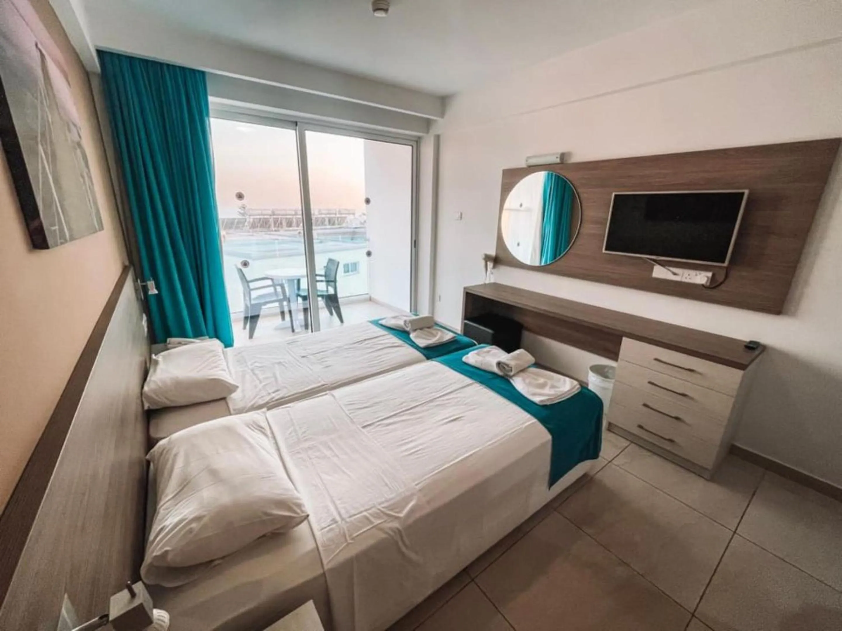 Bed in Sunny Blue Hotel