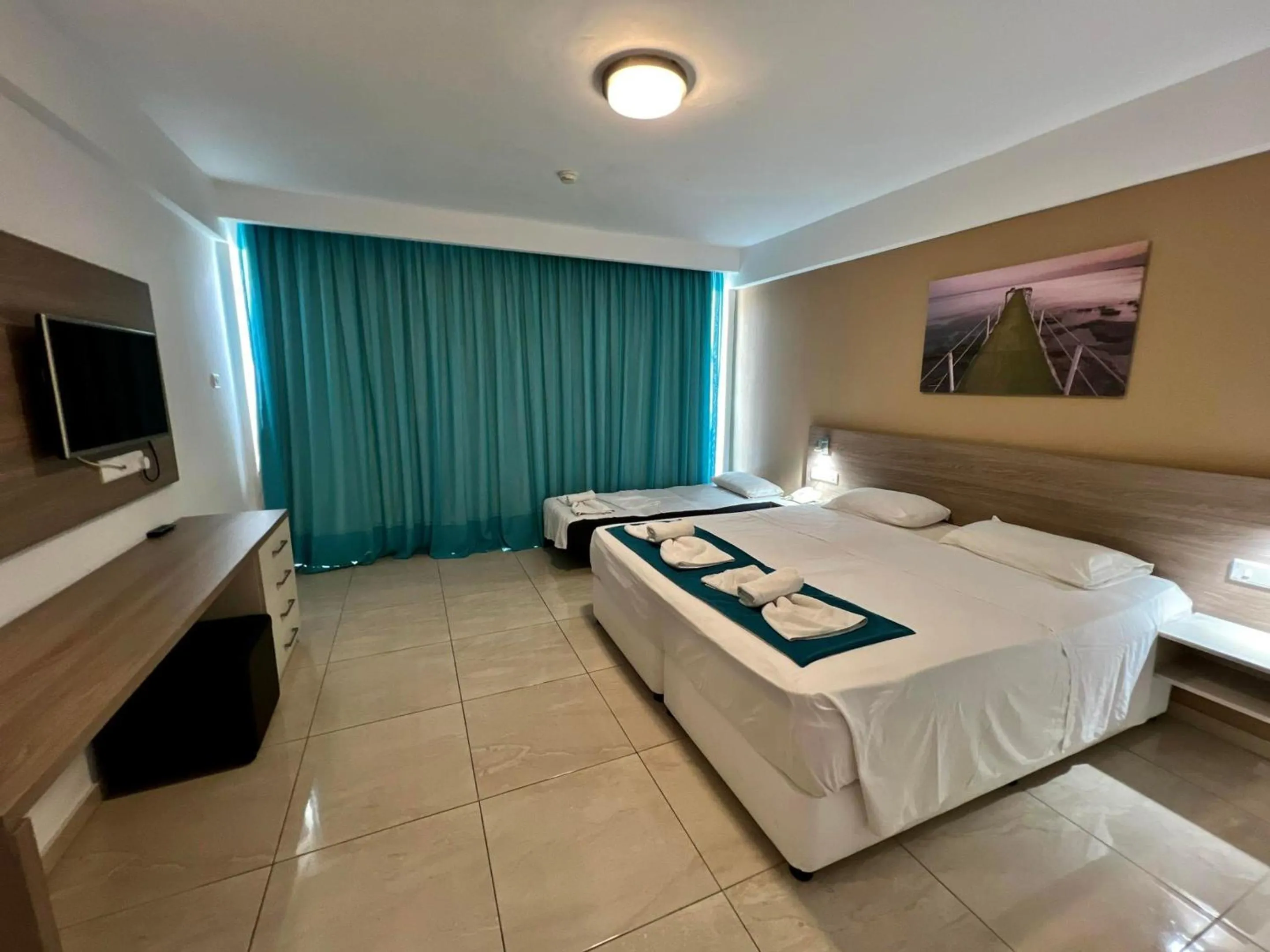 Bed in Sunny Blue Hotel