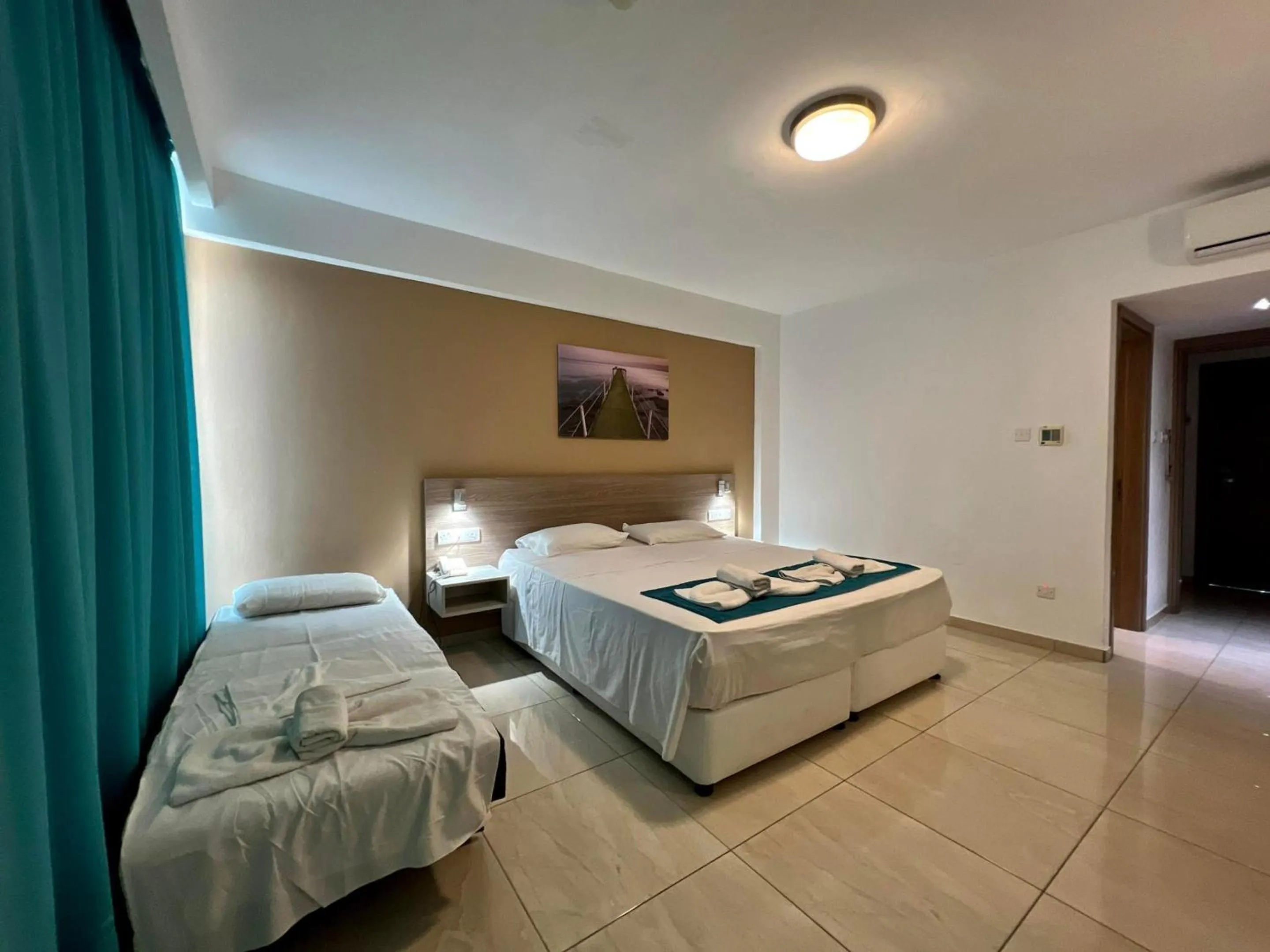 Bed in Sunny Blue Hotel