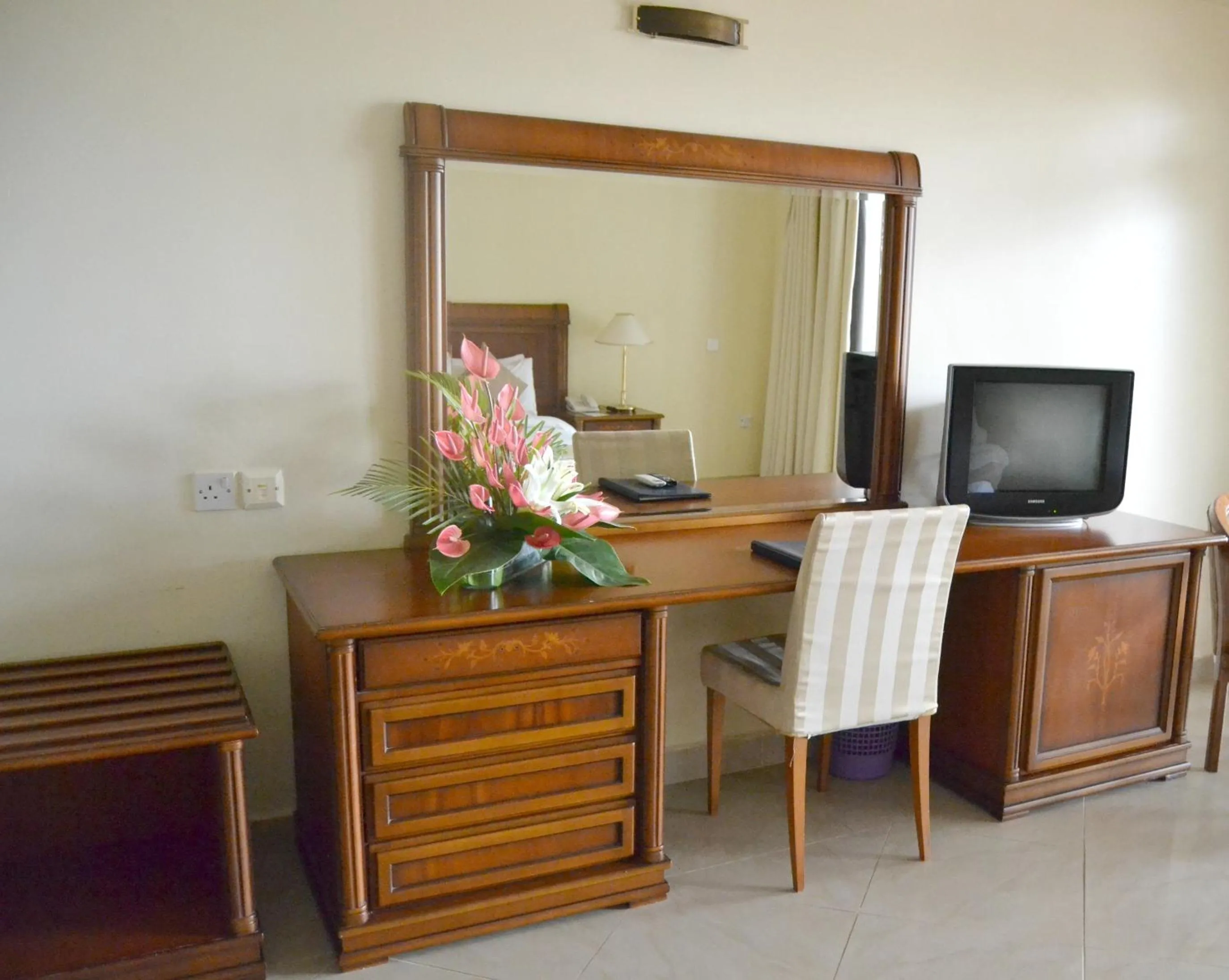 Bedroom, TV/Entertainment Center in Golden Tulip Tanzania
