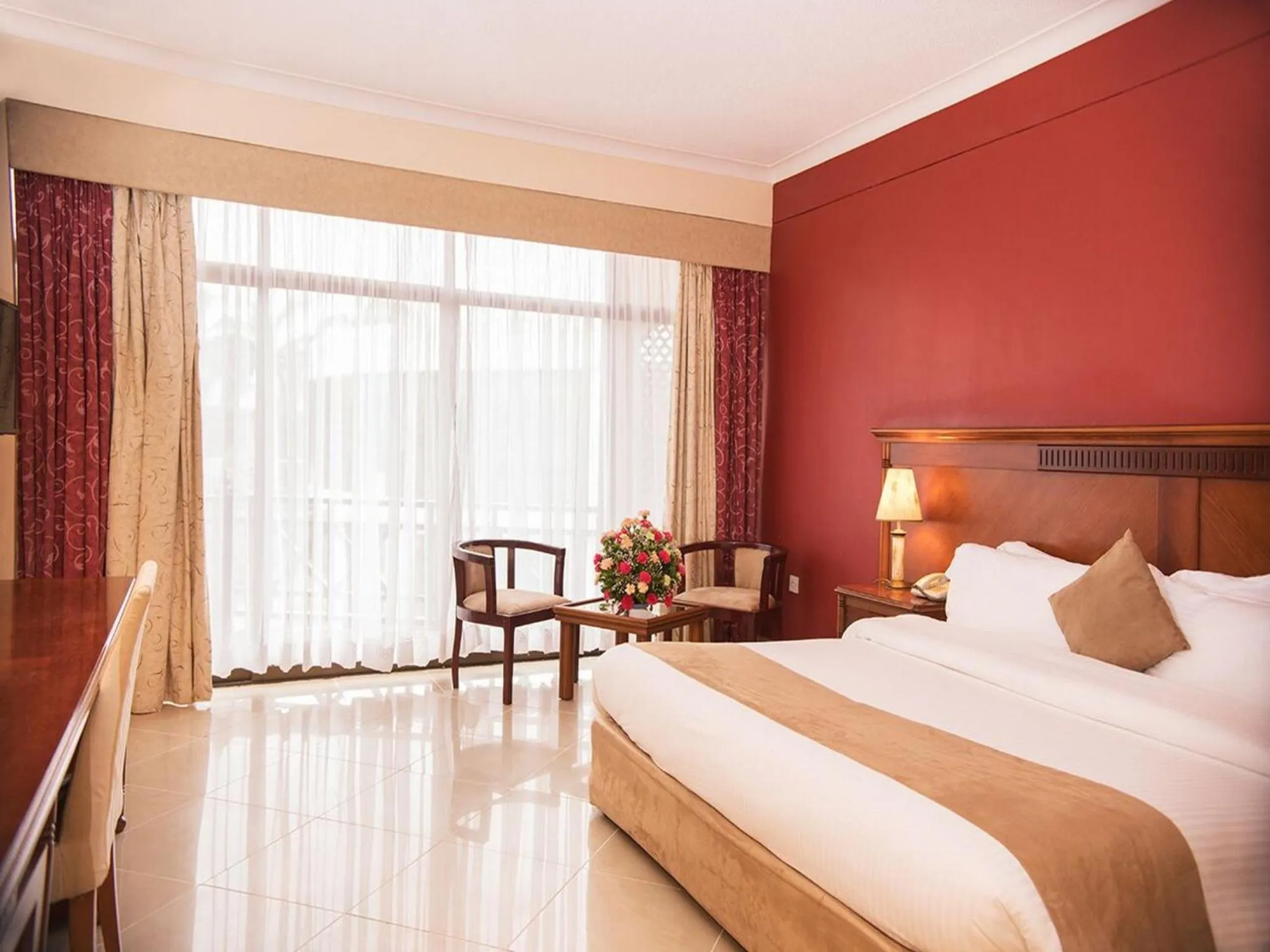 Bed in Golden Tulip Tanzania