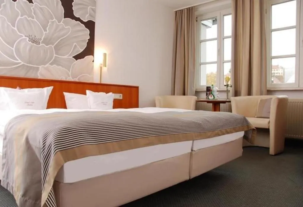 Photo of the whole room, Bed in Hotel Müller Café & Wein - Mondholzhotel